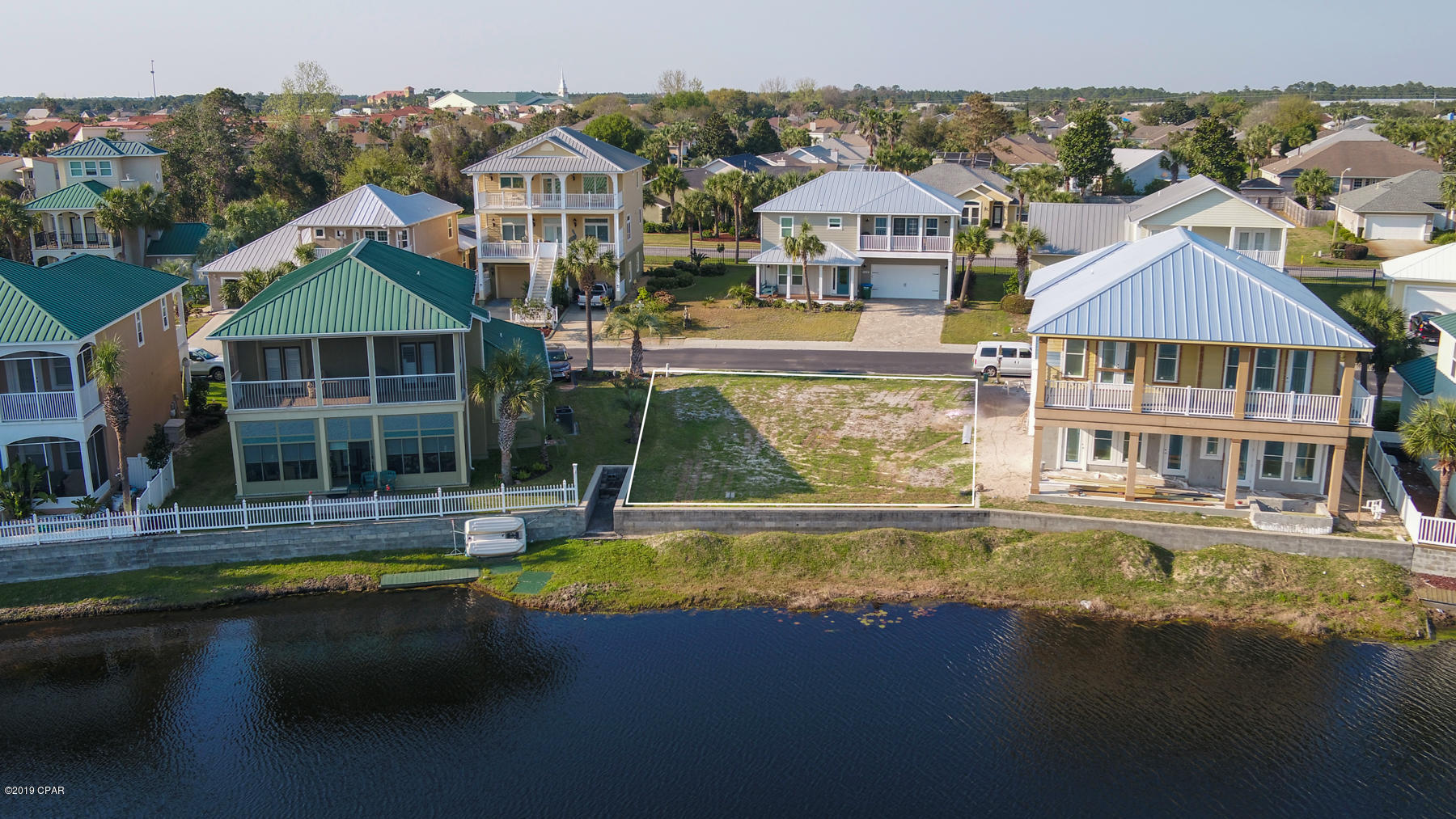 Build your dream beach home on this lakefront lot on the west end of Panama City Beach in the gorgeous and cozy neighborhood of The Lakes at Summer Breeze, the kind of place where people stop and wave to their neighbors.  This lot is nestled on a road with no thorough fare and is a very short golf cart ride to the beautiful  beaches of the Gulf of Mexico.  Only 1/2 mile from the hwy 79 junction, public beach access and proximity to Frank Brown, Aaron Bessant and Pier Park make this location very attractive.  Low HOA fees in a well designed neighborhood and just a short drive to the amenities of 30A make this lot an easy buy.

Lot measurements are approximate, please verify.