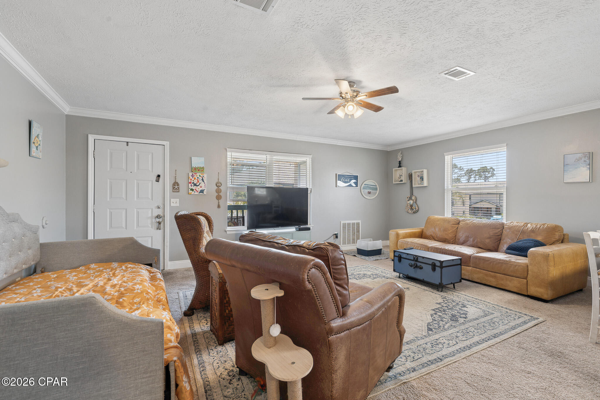 Welcome to this absolutely adorable, recently updated 2-bedroom, 1-bath condo offering 720 square feet of comfortable, easy living in one of Panama City Beach's most beloved waterfront communities. Step inside to a bright, open living area that flows effortlessly into two generously sized bedrooms, complete with the everyday convenience of an inside laundry area and a dedicated outside storage room for all your beach gear and extras. Laundry is located in the unit. Perched on the second floor, you'll enjoy added privacy and peace and quiet with no neighbors overhead.
Tucked along the scenic Grand Lagoon--a favorite local hub for fishing, boating, paddleboarding, and kayaking--Greenwood Estates is a quiet, low-traffic complex cherished for its laid-back, tranquil setting. Community amenities include a sparkling pool, a gated dock, and a covered picnic and grilling pavilion, the perfect spot to relax, entertain, or watch the boats glide by. The location is hard to beat: you're just about five minutes from sugar-white sand beaches, plus marinas, shopping, and some of the area's best dining right on North Lagoon Drive, including The Grand Marlin, Capt. Anderson's, and the beachfront favorite Schooners.
Whether you're searching for a full-time coastal home, a relaxed seasonal retreat, or a long-term residence near the water, this move-in-ready charmer delivers character, comfort, and an unbeatable lifestyle. Please note: this is an owner-occupant and long-term community--no short-term/vacation rentals. Homes like this in Greenwood Estates don't last long, so call today to schedule your private showing!