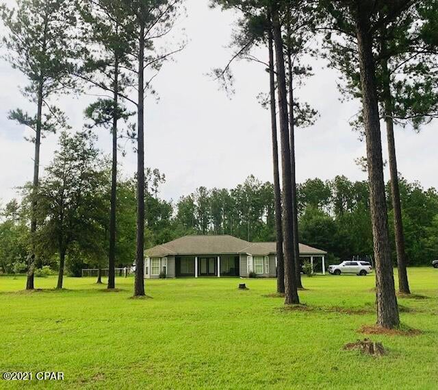 NEW PRICE! Beautiful, 3 bedroom/2 bath home in a quiet, country setting.  This spacious home features an open floor plan design with high, vaulted ceilings in the living room and an easy flow into the kitchen and dining room areas. Matching custom cabinetry is present throughout. Home is being sold with all kitchen appliances (purchased 2018) and washer/dryer. Home is wired for direct TV, dish network, satellite internet, and landline internet services in every room. It also has a state-of-the-art ADT security system. A number of upgrades have been made including new flooring and paint throughout, new fixtures, LED flood lights, and driveway. 20 minutes to Marianna, 40 minutes to Dothan. Nestled on a bit more than 2 acres, this home also offers a large, fenced-in backyard where you can relax on the custom swing or enjoy a dip in the new above-ground pool. Property has recent landscaping with composite 15-year maintenance free mulch with stone borders and a 10x14 storage shed. This home is a perfect retreat from the hustle and bustle of everyday life.
