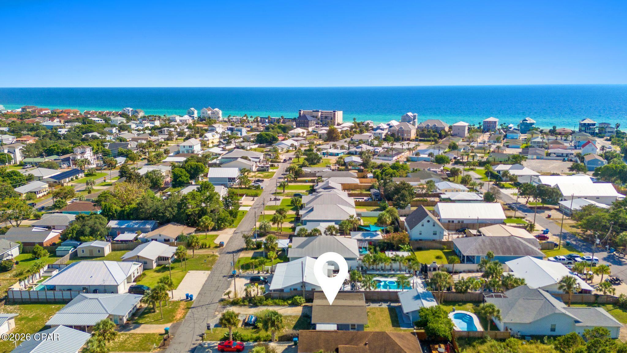 Just 0.3 miles from the sugar-white sand of West Panama City Beach, this unique property offers two separate concrete block homes on one spacious 50 x 125 lot. Tucked into a quiet cul-de-sac on a pretty street, it's an incredible opportunity for a beach getaway, short-term rental investment, or a little of both.
The 750 sq. ft. main home features 2 bedrooms and 1 bath, while the separate 400 sq. ft. studio has its own full kitchen and bath. Both are separately metered and have brand-new tankless water heaters, and the studio also features a brand-new mini-split AC with a dehumidifier.
Located in Flood Zone X, where flood insurance is not typically required by lenders, the property also has no HOA and is in a golf-cart-friendly community. And if you know Panama City Beach, you know the West End is loved for its beautiful beach access and laid-back coastal feel.
Just 10 minutes from both 30A and Pier Park, this is a rare opportunity to own two separate living spaces just minutes from everything that makes this part of the beach so special. Property appraised for $450,000 in April 2026