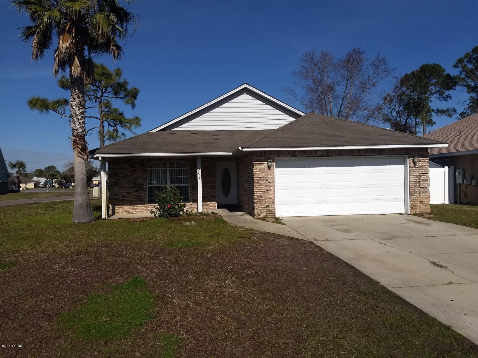 Great find in Panama City Beach. This is a 3 bedroom 2 bath home with a 2 car garage located in Hidden Pines - very close to the Navy Base, and just a short distance to the Hathaway Bridge to get to Panama City.  Also, just a short drive to the beach.  This home features a corner lot, tile floors, and fire place.