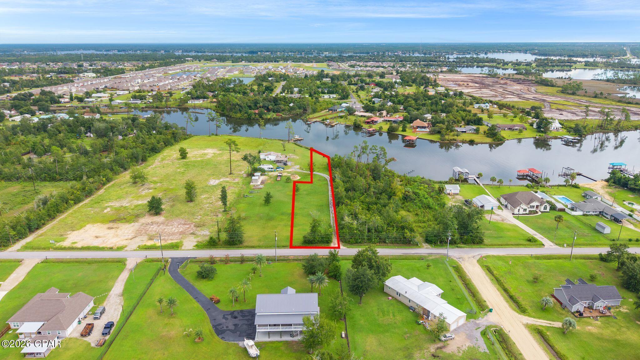 Own your own slice of Florida waterfront living! Situated along Gainer Bayou with deep-water access to the Gulf, this vacant waterfront property offers endless possibilities for enjoying life on the water.
Create the ultimate fish camp, boating retreat, weekend getaway, or build a home to enjoy year-round. Bring the boat, fishing gear, kayaks, and all your favorite water toys. With the potential to add a private dock, you can create the perfect setup for keeping your boat close and getting out on the water whenever the opportunity calls.
Seller will be installing an additional driveway as well so the one on property is yours! Buyer to verify all measurements and anything deemed important.