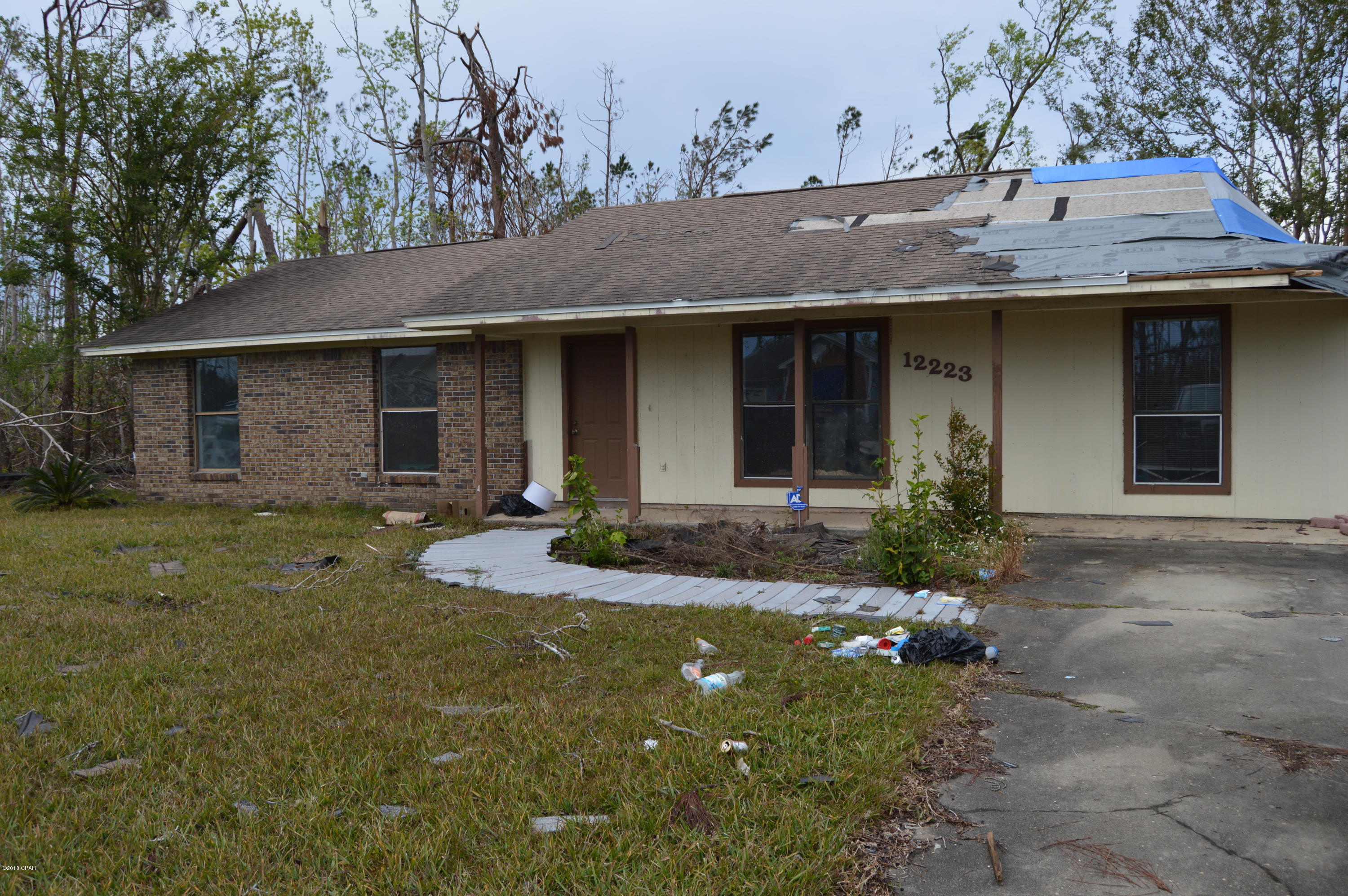 Opportunity Knocks!   Hurricane Michael Damaged 3 bedroom 2 bath home located in Sandy Creek near Tyndall Air Force Base is Being Sold AS-IS Where-is.  This home needs major repairs and may be only for the serious investor looking to rehab a home damaged by Hurricane Michael or Rebuild.  Buyer to verify all deemed important.  No Additional photos available.  This home was a former rental and seller has no knowledge.  Call today to get your offer in before someone else does.