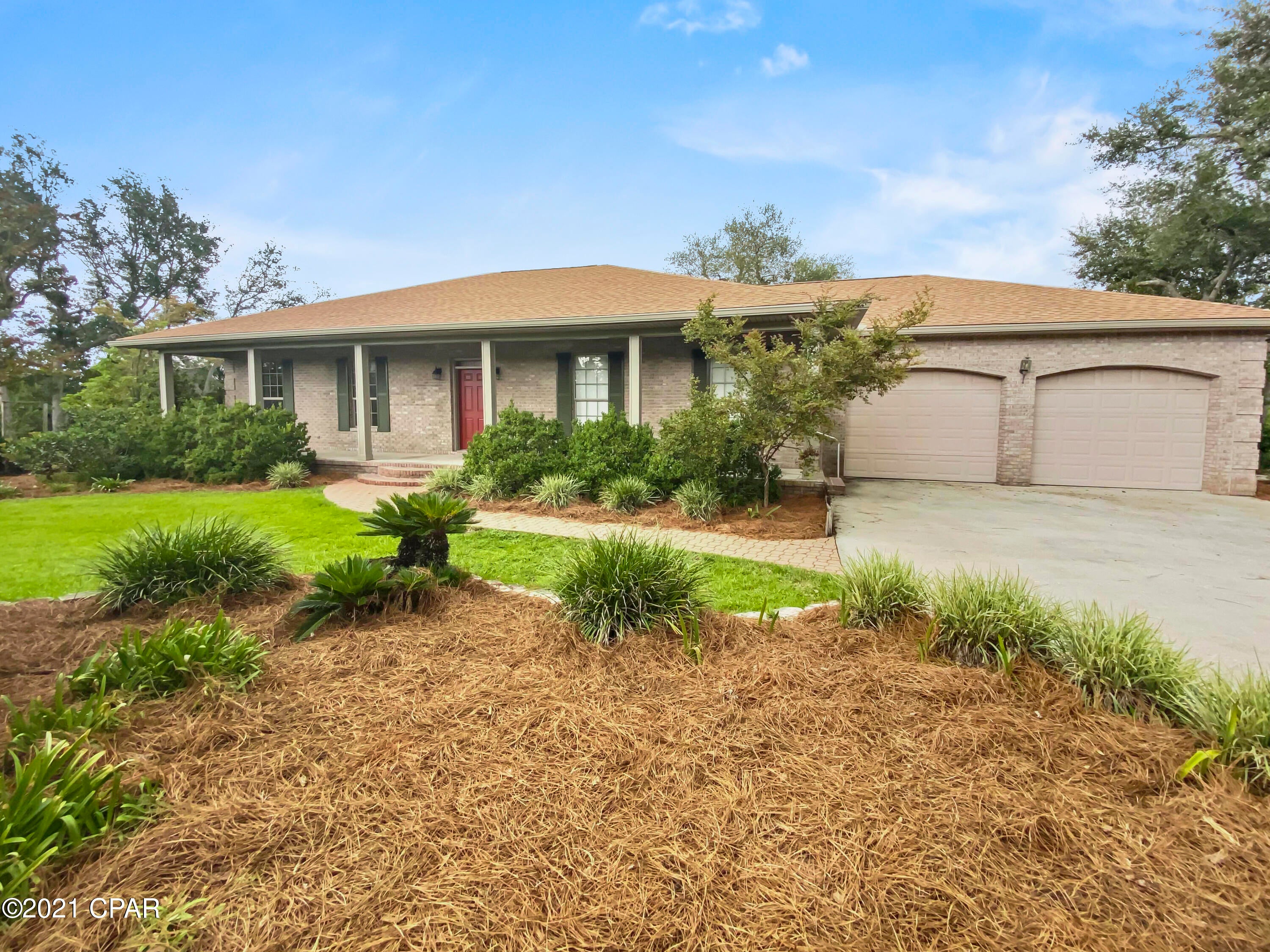 CURRENTLY UNDER CONTRACT, SELLER ACCEPTING BACKUP OFFERS' Are you looking for privacy, no HOA, with a large yard on water?  This is the place for you. All brick home with open floor plan, 3 bedrooms, 2 baths, an office, a dining room and a large sun room. The kitchen has a spacious pantry, an island with a cook top, a large breakfast bar and an eat in area with a bay window looking over the back porch and backyard. 

With a split floor plan, the master bedroom has a large master bath, with a soaker tub and separate shower and two closets. The master closet is very large and also serves as a safe room. The split floor plan offers two additional bedrooms and a bathroom near the dedicated office space. You'll enjoy the natural lighting in the sun room with the bay window off of the living roo A surprise awaits you in the laundry room, it has a work/craft/flex space for whatever you want to make it. The back porch has shady trees to sit and enjoy the water and beautiful landscaping. Other buildings on the property include a large workshop with two roll up doors that allow you to drive through the shop if needed. There is also a barn structure with recreational area that is usable. The small brick building near the house stores the water softening system is the perfect spot to make your she shed! This place has so much to offer and is close to everything!