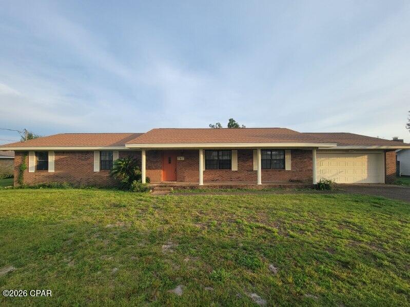 Spacious 3-bedroom, 2-bath brick home in central Panama City, just off 23rd St., with a two-car garage. Plank flooring runs throughout, with carpet in the bedrooms. The living room features vaulted ceilings with accent beams and a wood-burning fireplace. The kitchen is generously sized, with a breakfast nook, a smooth glass cooktop, a separate built-in oven, dishwasher, and refrigerator, plus plenty of counter space, cabinetry, and a pantry. A formal dining area and a bonus nook for a home office round out the main living space.

The primary bedroom offers two closets and a private bath, while the two additional bedrooms are generously sized as well. A separate laundry room comes equipped with a washer and dryer Large backyard is fully fenced.

Ideally located for an easy commute to Panama City Beach or Tyndall AFB, with shopping, restaurants, schools, and a hospital all nearby. Call to schedule a tour today!