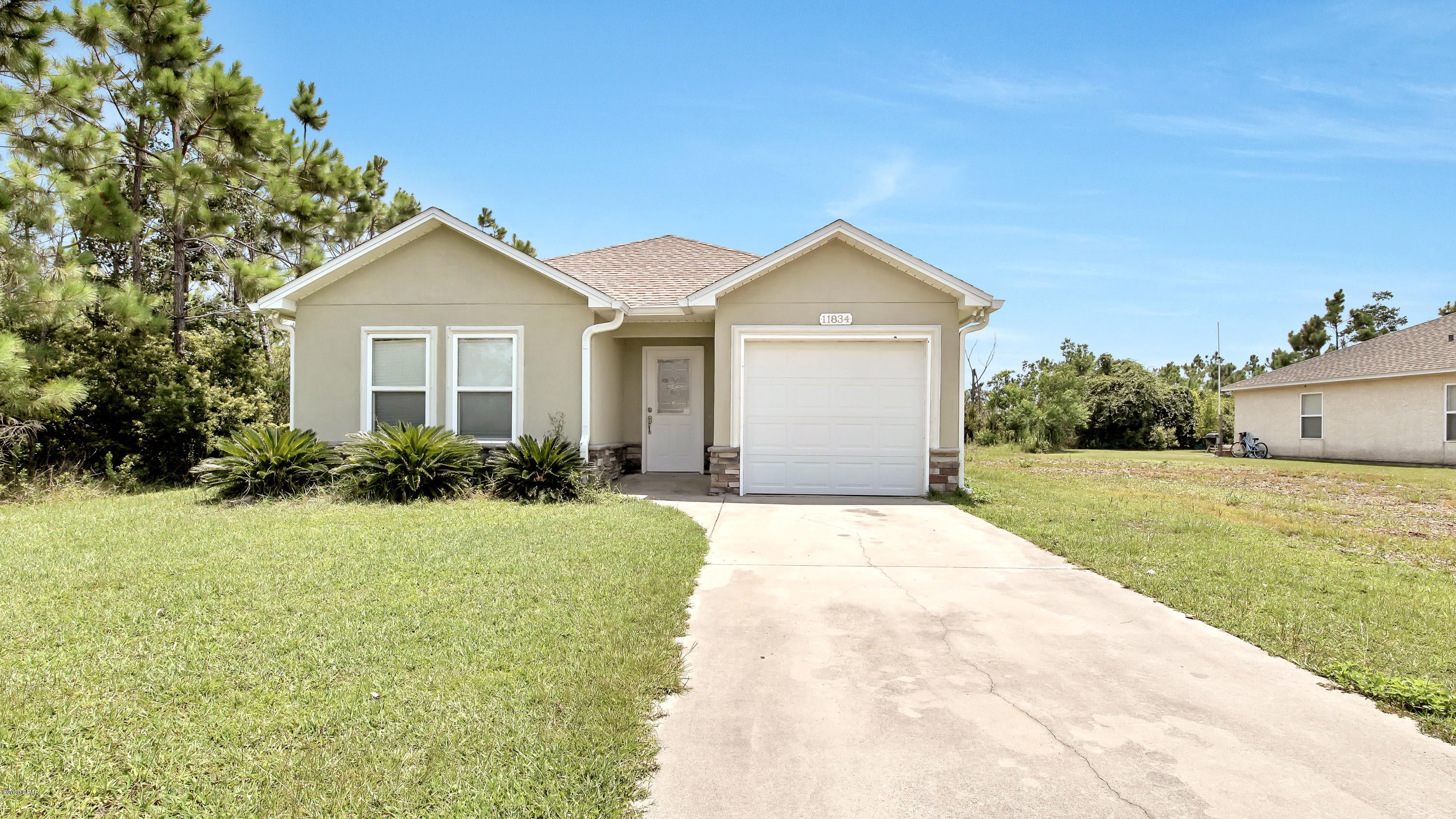 Country living at its best with 3 bedrooms/2 bathrooms, and a single car garage. Home features granite counter tops, decorative tile floors, refrigerator with ice/water and ceiling fans. Split floorplan, bedrooms are carpeted, privacy fence and gutters. It is located in Sandy Creek Country Club and is 15 minutes from Tyndall Air Force Base and 20 minutes to downtown Panama City.