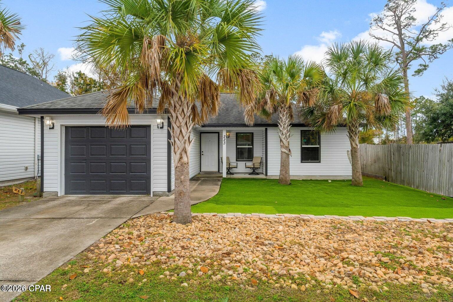 HIGHLY MOTIVATED SELLER -- BRING ALL OFFERS!

Don't miss this opportunity to own an updated 3-bedroom, 2-bath home in the desirable Woodlawn neighborhood of Panama City Beach! Tucked away at the end of a quiet cul-de-sac, this move-in-ready home offers a fantastic combination of location, upgrades and value.  Some photos have been virtually staged.

Inside, you'll find a bright, open floor plan featuring granite countertops, upgraded cabinetry and durable LVP flooring throughout the main living areas, with comfortable carpeting in the bedrooms. Recent improvements include a newer HVAC system, newer water heater and energy-efficient paid off solar panels, helping keep monthly utility costs low.

Outside, the oversized driveway offers plenty of room for multiple vehicles, guests, a boat or jet skis, plus the home includes an attached garage and screened porch.  PLUS, astroturf installed in front yard!

Location is a major bonus! You're just minutes from the Navy Base, shopping, restaurants, St. Andrews, Pier Park and the beautiful white-sand beaches of Panama City Beach.

Whether you're looking for a primary residence, second home or a great Panama City Beach property, 223 Woodlawn Court deserves a look.

SELLER IS HIGHLY MOTIVATED AND READY TO MAKE A DEAL -- BRING ALL REASONABLE OFFERS! Schedule your private showing today!