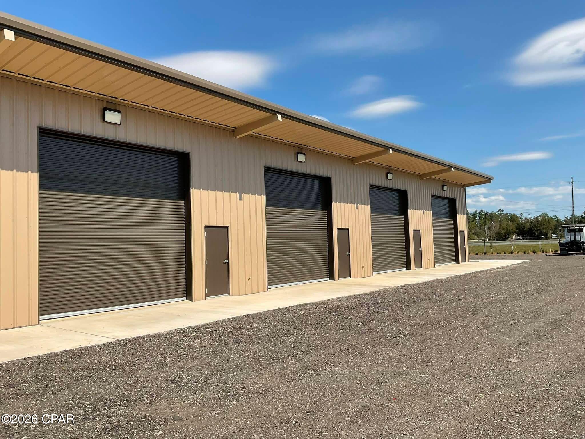 Commercial warehouse space now available for lease on Highway 77, approximately 10 minutes north of Lynn Haven! Bay #1 offers approximately 1,250 square feet (25' x 50') of versatile space with a commercial classification and is situated on approximately 3.47 acres. This unit features a glass storefront/entry, private restroom, air conditioning, large roll-up door, concrete flooring, high ceilings, and an open warehouse configuration that provides flexibility for a variety of commercial needs.

With convenient access along the Highway 77 corridor, this space may be ideal for business or contractor storage, inventory and equipment storage, RV or boat storage, workshop space, or other commercial uses. The oversized roll-up door provides convenient access for larger vehicles, equipment, and materials, while the storefront entrance, restroom, and air conditioning add functionality for businesses needing more than traditional storage space. 

Bay #1 is currently available. Contact your real estate professional for lease terms, showing instructions, and additional information.