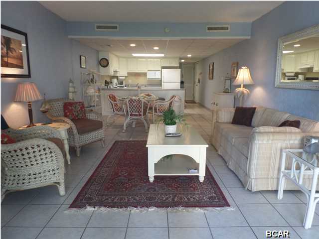 ...10% down for primary or second home and 15% down for investment property offered through Supreme Lending. Park right at your front door at this lovely condo no waiting on elevators! This 1 bedroom 1 bath condo is turn-key, furnished and ready to enjoy. Tile throughout the main living and kitchen area and carpet in the master bedroom, you will notice how clean and well decorated this wonderful condo is! It is a great Beach get-a-way condo or investment property. Sit out on the patio overlooking the freshwater pond, where you can feed the ducks and Koi fish or stroll along the walking path towards the Beach and enjoy the beautifully landscaped and lush inner courtyard. The Sugar Beach property is a low-rise, low density property that features tennis courts, a swimming pool, grilling