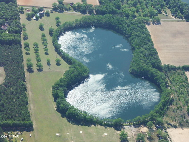 WATERFRONT lot on the beautiful Strickland Lake.    Nice flat, lots with road and water frontage ready for you to build your dream home.   Underground utilities already provided.    Lot sits in a way where you can fully enjoy the sunsets.    Located only a few miles from Interstate 10 between Marianna and Grand Ridge south of the interstate.  Owner/Broker Call today to see for yourself!!