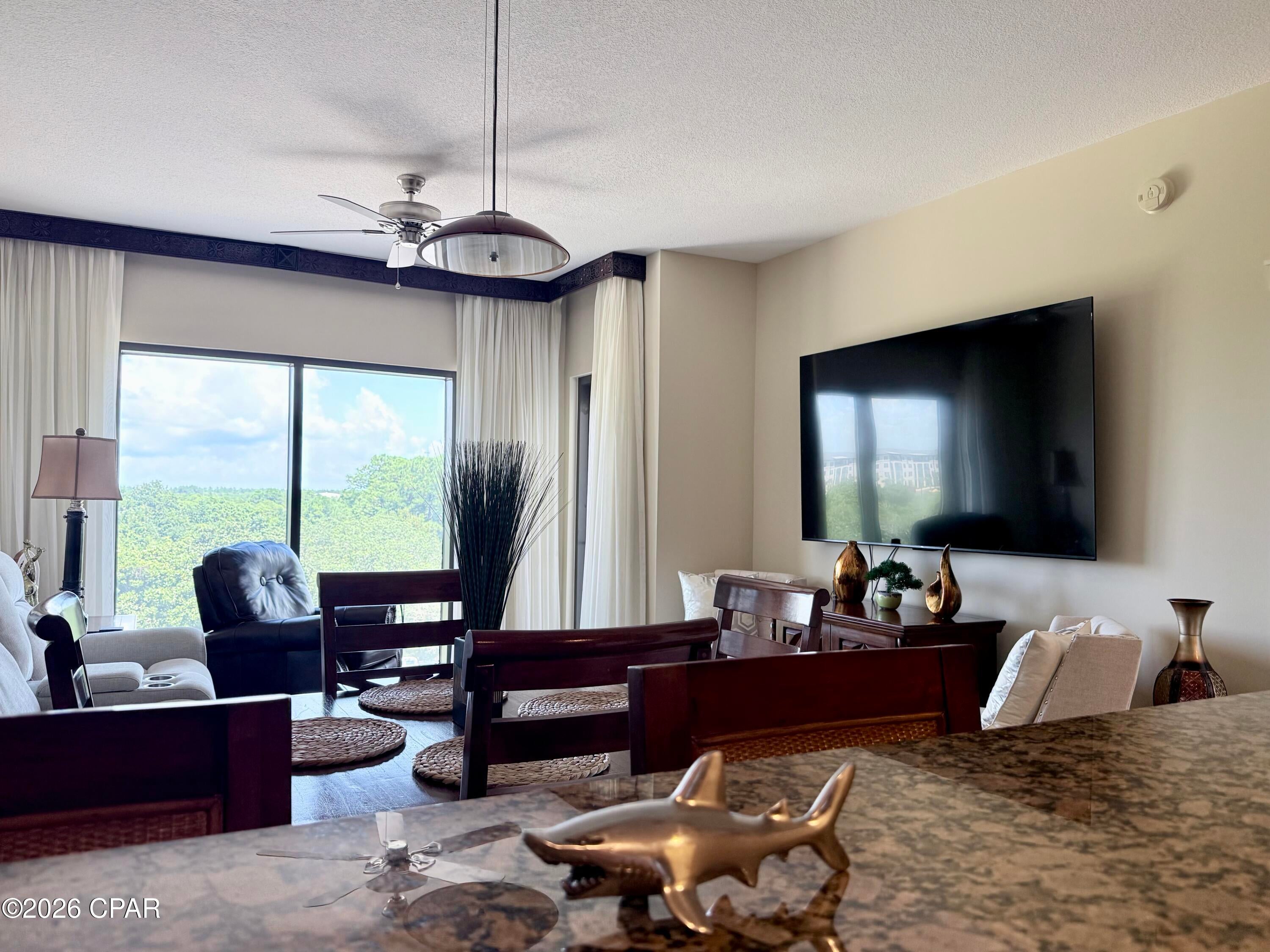 This Fully furnished, move-in, or rent ready, 1 bed, 1 bath condo on the back east corner of the building offers stunning sunrise and Gulf views from the balcony and bedroom.  Origin 527 is not on a rental program, and kept in pristine condition.  Only used by the owner as a personal beach retreat multiple times throughout the year.  It has recently replaced high end carpet with plush padding, an brand new reclining sofa, brand new 85'' TV,  new hot water heater, and new toilet.  The kitchen has all major appliances you expect in great condition.  This living/ dining area is spacious and inviting.  The bedroom fits the king sized bed with plenty of room to move around and has a large closet suitable for a weeks' stay or full time resident.  Just off the living room is the patio door leading to an oversized balcony with nature and Gulf views.  This one is ready to go with little attention needed for a long, long time to come!  

Origin is located across the street from Sharky's beachfront restaurant and bar, and within walking distance to Pier Park, and a multitude of dining and entertainment options.  Origin offers many amenities including two BBQ grill/picnic areas, a heated pool, hot tub, theater, game room, laundry facility, vending, a gated community with 24-hour security, a Sunsations beach store located on the ground level, and the new Beaches and Cream convenient store offering eats and drinks right on property.  Origin is also one of the very few high-rise condos in PCB to offer interior corridors, keeping you safe and dry during inclement weather. 

If you're looking for the perfect, affordable property make your personal retreat, don't miss the opportunity to see Origin 527 in person.  Give me a call anytime to schedule your personal showing!