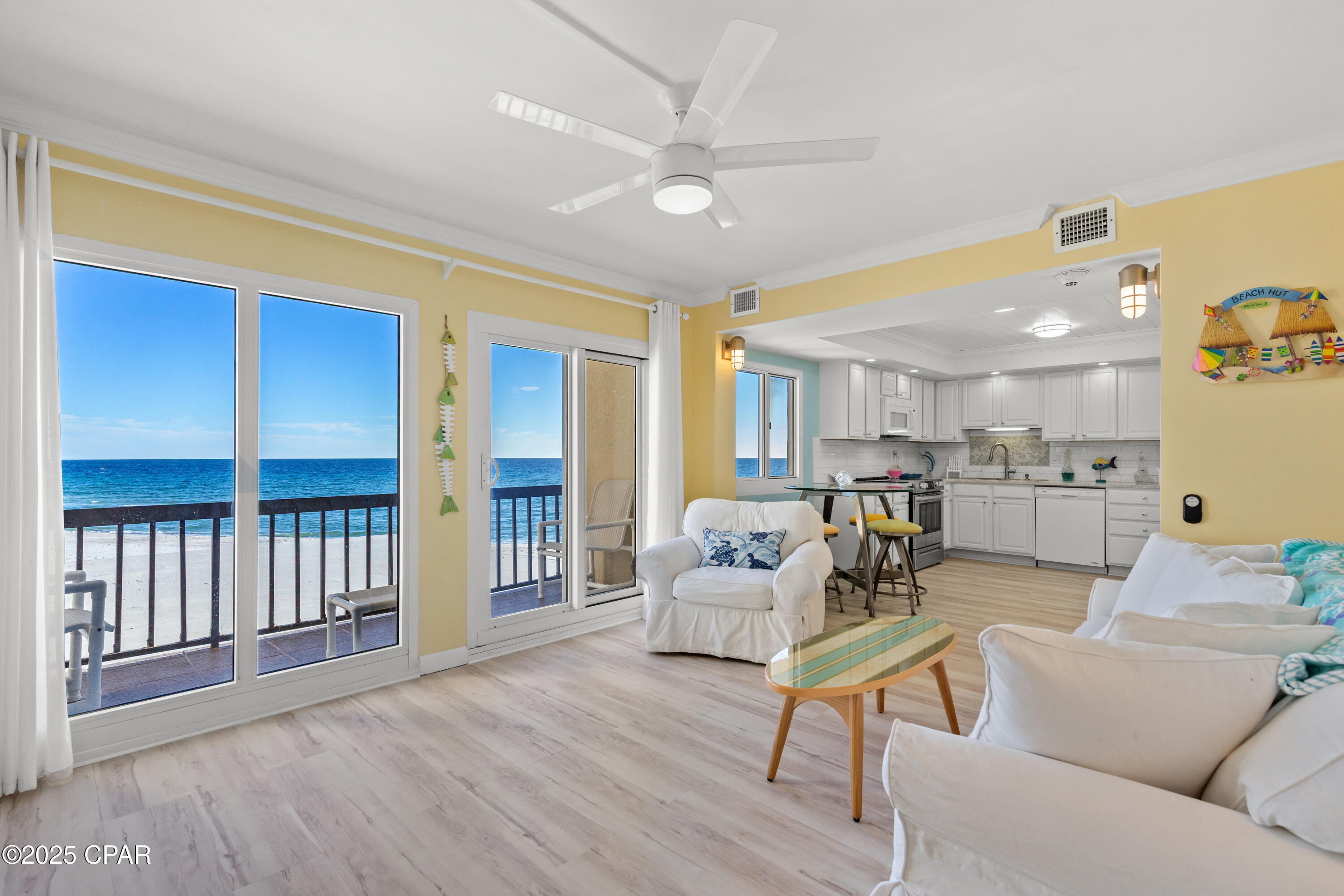 Seller will pay the current Special Assessment of $70,008 for both the Milestone Reconstruction Project and the Structural Integrity Reserve Study, in full,  when it becomes payable.  A distinguishing characteristic of this unit is its three balconies, making it one of only two at Pinnacle Port to offer this feature. Conveniently situated on the first (not ground) floor adjacent to the stairwell--with elevator access available--the layout ensures both accessibility and privacy.
This meticulously renovated Gulf-front condominium features three bedrooms and three bathrooms across two levels, offering inviting aesthetics inspired by the sun, sky, sea, and sand. The residence is fully furnished and move-in ready.
Notable interior features include elegant crown molding, distinct ceiling treatments with shiplap detail in the kitchen, recessed lighting, tile backsplash, upgraded cabinetry with solid-surface countertops, ceiling fans, and smooth ceilings throughout. Appliances--including the stove, refrigerator, microwave, and stacked washer/dryer--are less than two years old.  Upgraded bath vanities and fixtures are found in all three bathrooms.
Kitchen and laundry spaces have been thoughtfully redesigned to optimize available floor area. Luxury vinyl plank flooring extends through living areas, with tile present in each bathroom. An open staircase enhances the entry, providing an immediate line of sight to the first level Gulf and Beach and to the upper level while showcasing wood steps.
The main level primary bedroom includes an ensuite bath with a tiled shower, a spacious walk-in closet, and private balcony overlooking the Gulf and beach. The second primary bedroom is located upstairs and offers its own ensuite bath with a tub/shower combination, plus a private balcony with views of the Gulf, beach, and Tower Pool Deck. The third bedroom presents a wall-to-wall window framing the Gulf and beach, complemented by ample closet space for storage and apparel. The third bathroom, situated off the hallway, includes a large walk-in tiled shower.

Pinnacle Port Resort is set on over 25 acres within a secure, gated community, with more than a quarter-mile of beach frontage. Amenities include two swimming pools, tennis courts, sauna/steam room, fitness center, private freshwater dock with boat slips and launch, and complimentary Wi-Fi. Association fees cover electricity for heating, cooling, and hot water; owners are responsible only for a minor electric cost associated with lighting and appliances.