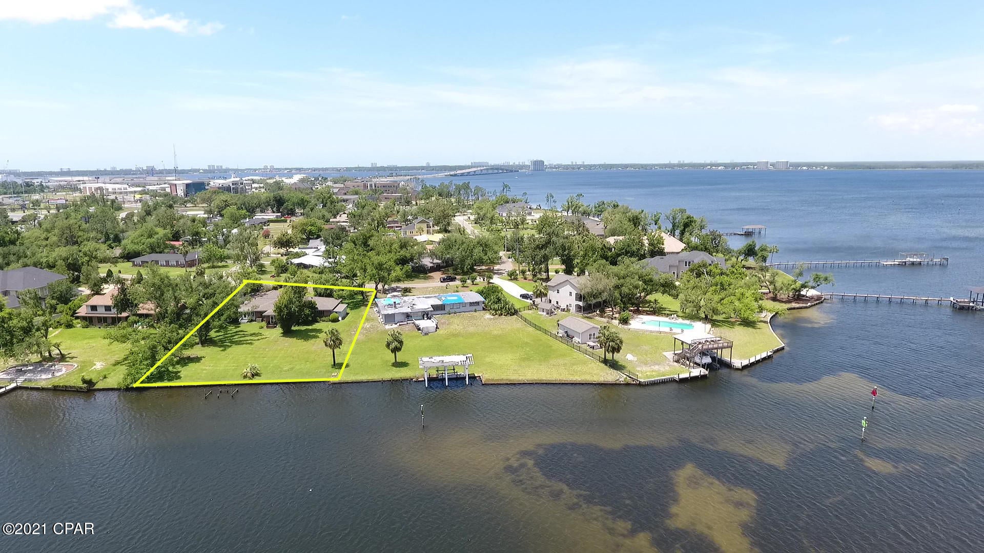 Rare waterfront home well maintained by original family with 100' of waterfront on Posten Bayou...adjacent to FSU campus. Surrounded by a quaint neighborhood safe to walk and bike.  Original subway tile floors in the baths with retro feel, open view to the bayou from the living room, dining room and formal den. Dining room and den have trey ceiling detail. Wood floors add warmth Formal den has fireplace and warm wood wall covering giving it an old world feel. Small Florida room extends from the living room for a view of the bayou and small peak of North Bay. Large laundry room and full bath adjacent to den. Appliances are in working condition. Large landscaped front and backyard. Home has one corner in flood zone and policy rung $1100 per year. Den on south side can be a bedroom with bath