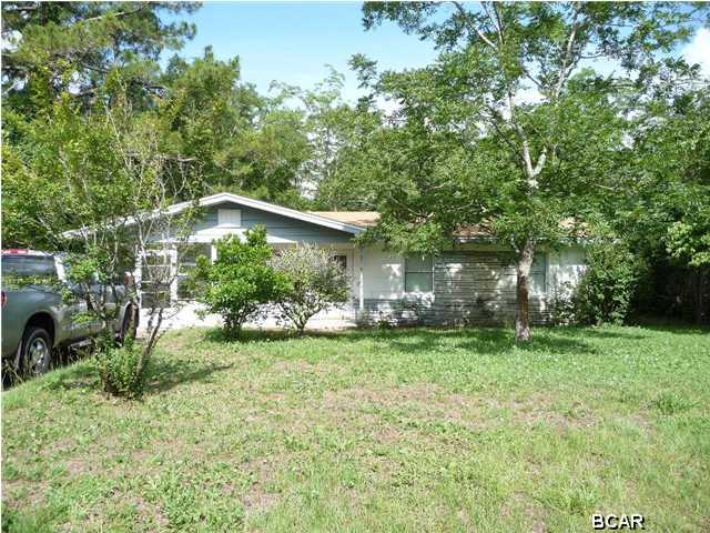 Nice clean home in Lynn Haven... 3 bedrooms, 1 bath with a large front screened in porch with new vinyl flooring, a fenced backyard, yard building.