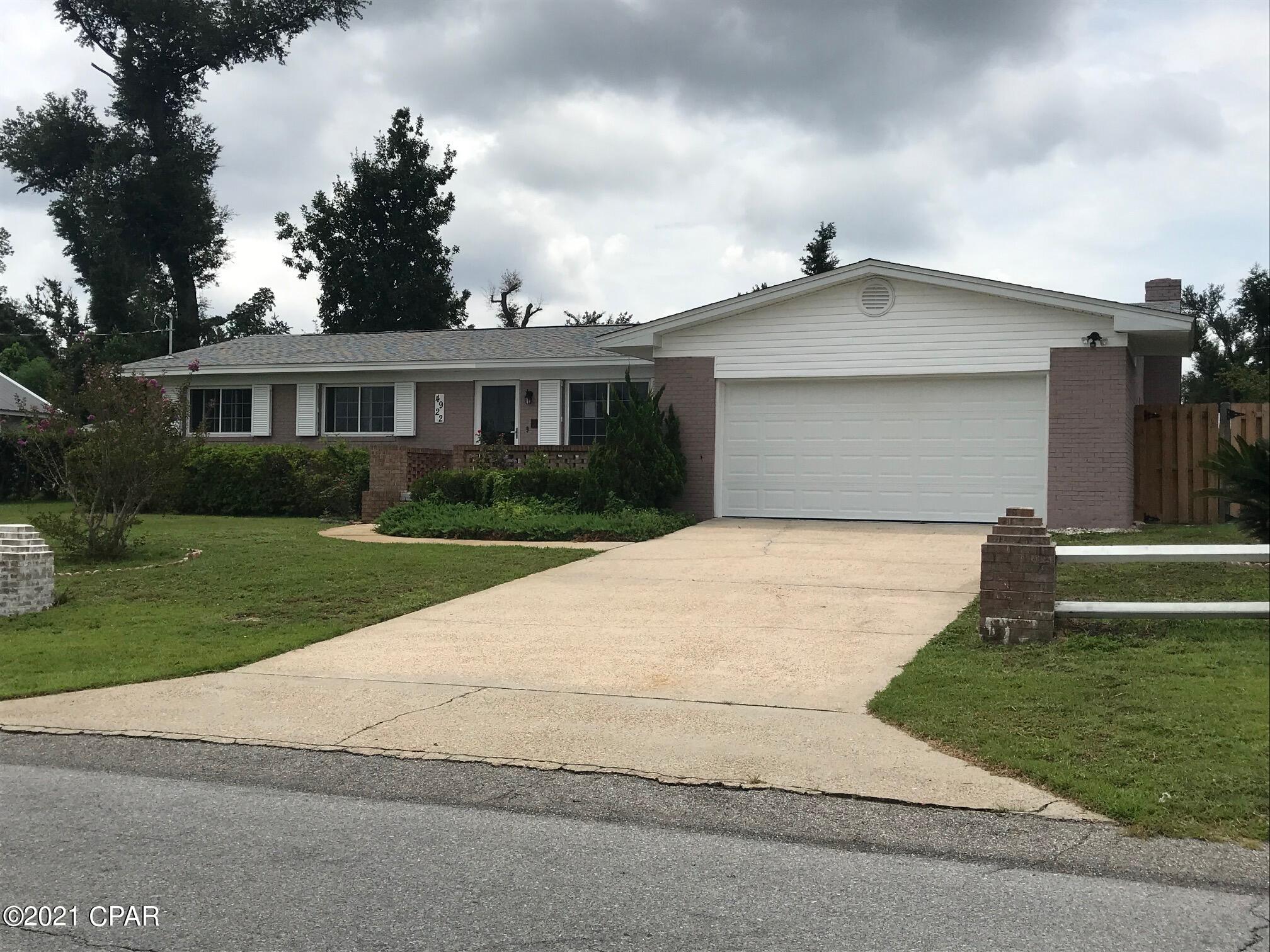 Ready for a New Family!!  This home is practically brand new.  New Garage, New Paint, New Floors, New Shed, New AC, New Duct work, New, windows.  Beautifully situated on a high lot with no water drainage issues.  High and dry.  This property also  boasts of a nice shed/outbuilding landscaped with a sidewalk area surrounding, and a double swing privacy fence to park a boat.  Back patio is huge.  Enjoy sitting out back and looking at the beautiful yard.  AC works amazing.  Two living rooms, one with a fireplace.  This property is priced to sell and won't last long.  Schedule your showing today.