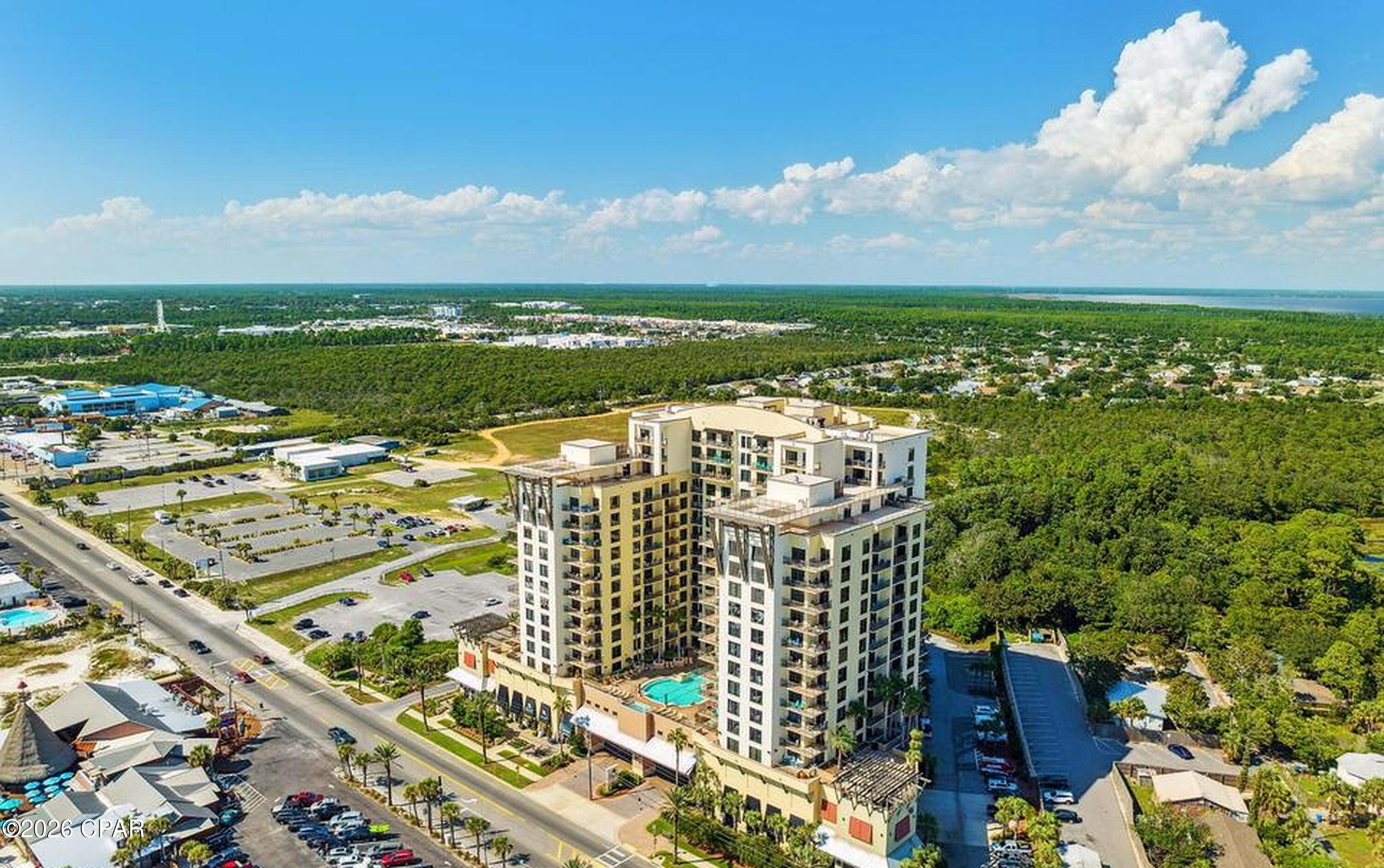 Origin 919 + 921 delivers the kind of Panama City Beach ownership opportunity that is becoming harder to find: a 9th-floor coastal-view condo with a flexible lockout-style layout, two private balconies, two separate entrances, and strong short-term rental appeal inside the highly recognizable Origin at Seahaven.

This 2-bedroom, 2-bath retreat is designed for flexibility. Keep the space connected as one comfortable beach condo, or use the adjoining layout to create privacy between guests, families, or owner use and rental use. From the balconies, enjoy elevated coastline views and beautiful morning light, while being positioned just steps from the Gulf and minutes from Pier Park, Gulf World, Sharky's, restaurants, shopping, and entertainment.
Origin at Seahaven offers the amenities vacationers look for in a PCB resort condo, including a pool, hot tub, fitness center, game room/arcade, theater-style common areas, covered parking, and easy beach access. For investors, second-home buyers, and buyers searching specifically for a Panama City Beach vacation rental near Pier Park, Origin 919 + 921 stands out because of its location, lockout-style functionality, guest-friendly layout, and placement in one of the area's most searched resort corridors.
This is not just another beach condo. It is a flexible coastal asset in a high-demand Panama City Beach location.

Interior Photos Coming Soon!
