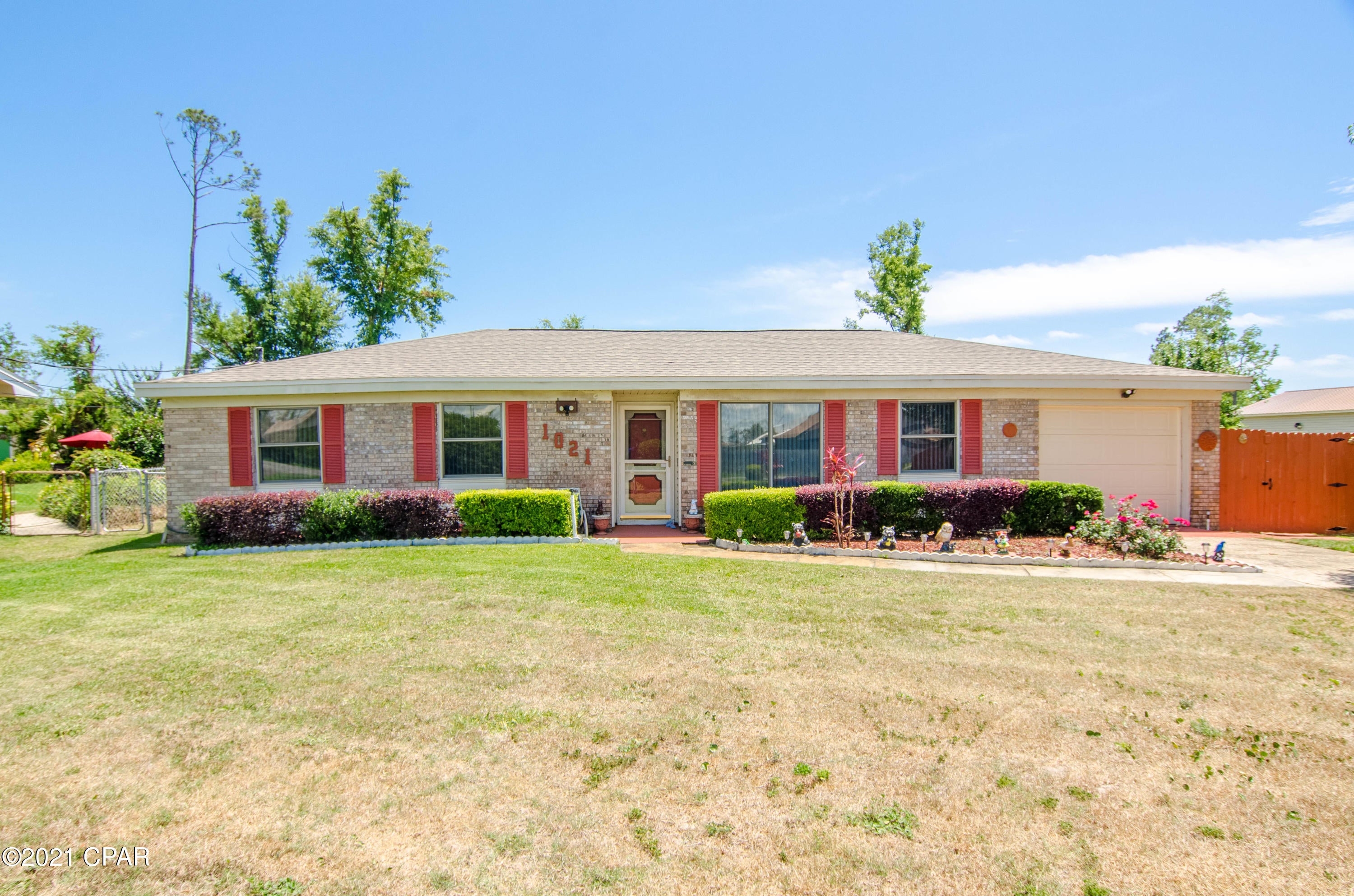 *Newer AC & Roof *Partially furnished *Large backyard *Shed - You will fall in love with this extremely well maintained 3BR/2BA brick home located on a quiet street. When you enter the home you will be greeted with an oversized L shaped Livingroom. The kitchen showcases beautiful wood cabinets, granite countertops and stainless steel appliances. You will enjoy the breakfast nook that is off of the kitchen and features a glass sliding door leading the the screened in covered porch and large  yard. The backyard is very private and has a workshop/shed. When you head back inside and down the hall you will find the 2 spare bedrooms, a spare bathroom with tub/shower combo and the master bed and bath. The master bath features a welkin tile shower. There is also a one car garage. Washer.... and dryer convey. Seller has marked all items with blue tape that they will be taking. All sizes, ages and short term rental allowability are approximate, please measure and/or verify if important.