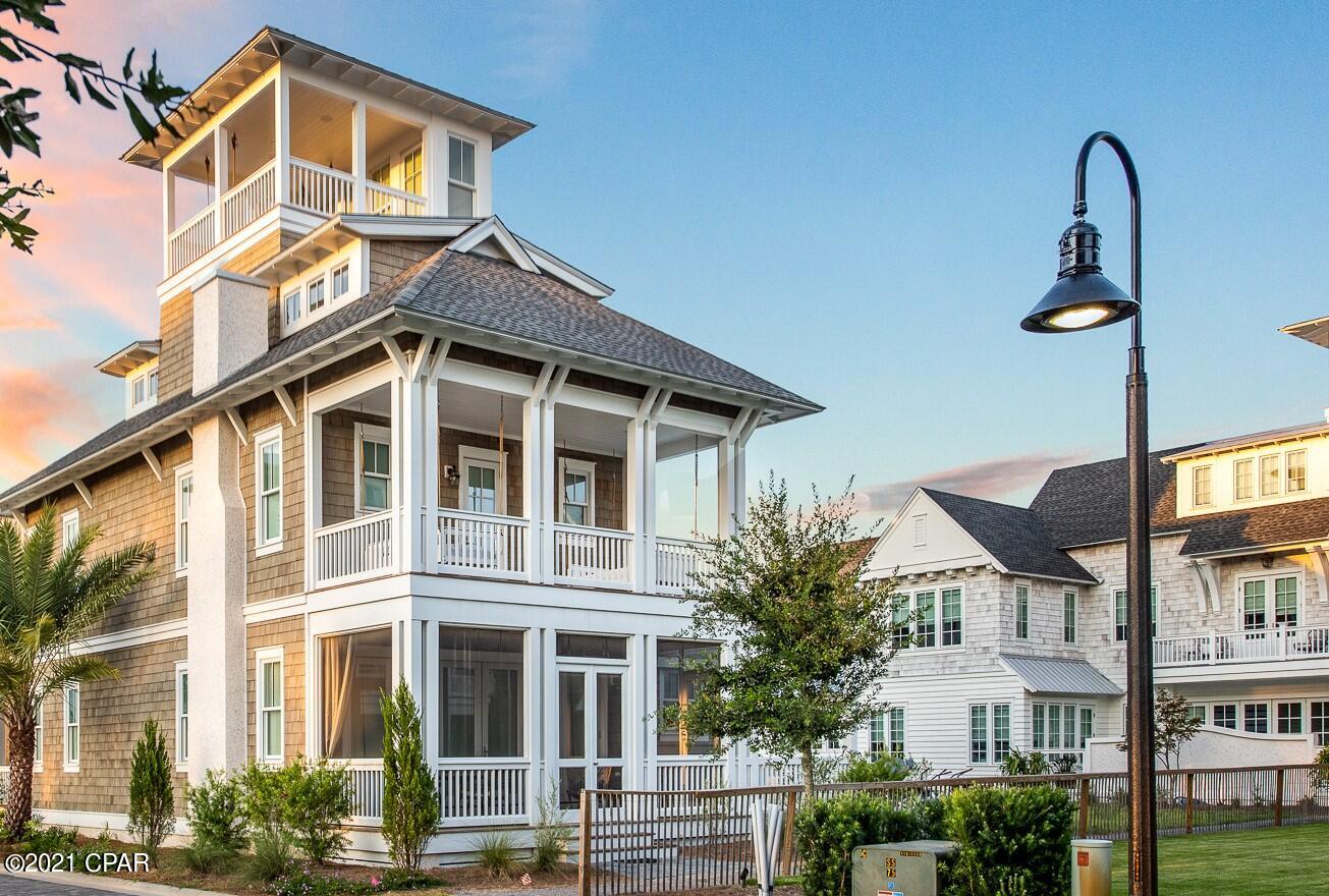 This coastal living community embraces the lifestyle for which 30a is known.  Grace Point provides a private, gated entrance to the sensational Watersound Beach Club and beach  access.  This home has 800 SQ FT OF COVERED OUTSIDE LIVING SPACE for enjoying gulf breezes any time from your front porch, a screened porch, a large balcony, and a crow's nest with gorgeous views of the emerald green gulf.  This corner lot home is positioned on one of the many green spaces throughout Grace Point.  The hinged glass patio doors fully open to the screened porch blurring the line between indoor and outdoor living.   Two covered balconies with 3 oversized swings.  Home is fully furnished and includes a Sub-zero refrigerator and Wolf stove, 6 TVs, surround sound in family room, and speakers throughout the 4 floors.  The home is beautifully decorated in coastal chic offering a serene atmosphere for entertaining or just relaxing. Maybe relaxing in the pool or hot tub.  This home sleeps 12 comfortably.  The interior has been freshly painted, floors refinished, and decorated to welcome everyone into this lovely home.  The exterior has been recently painted and gutters installed. The Hub and its shops and entertainment are a short walk away! Come see this beautiful home in a great 30A gated community