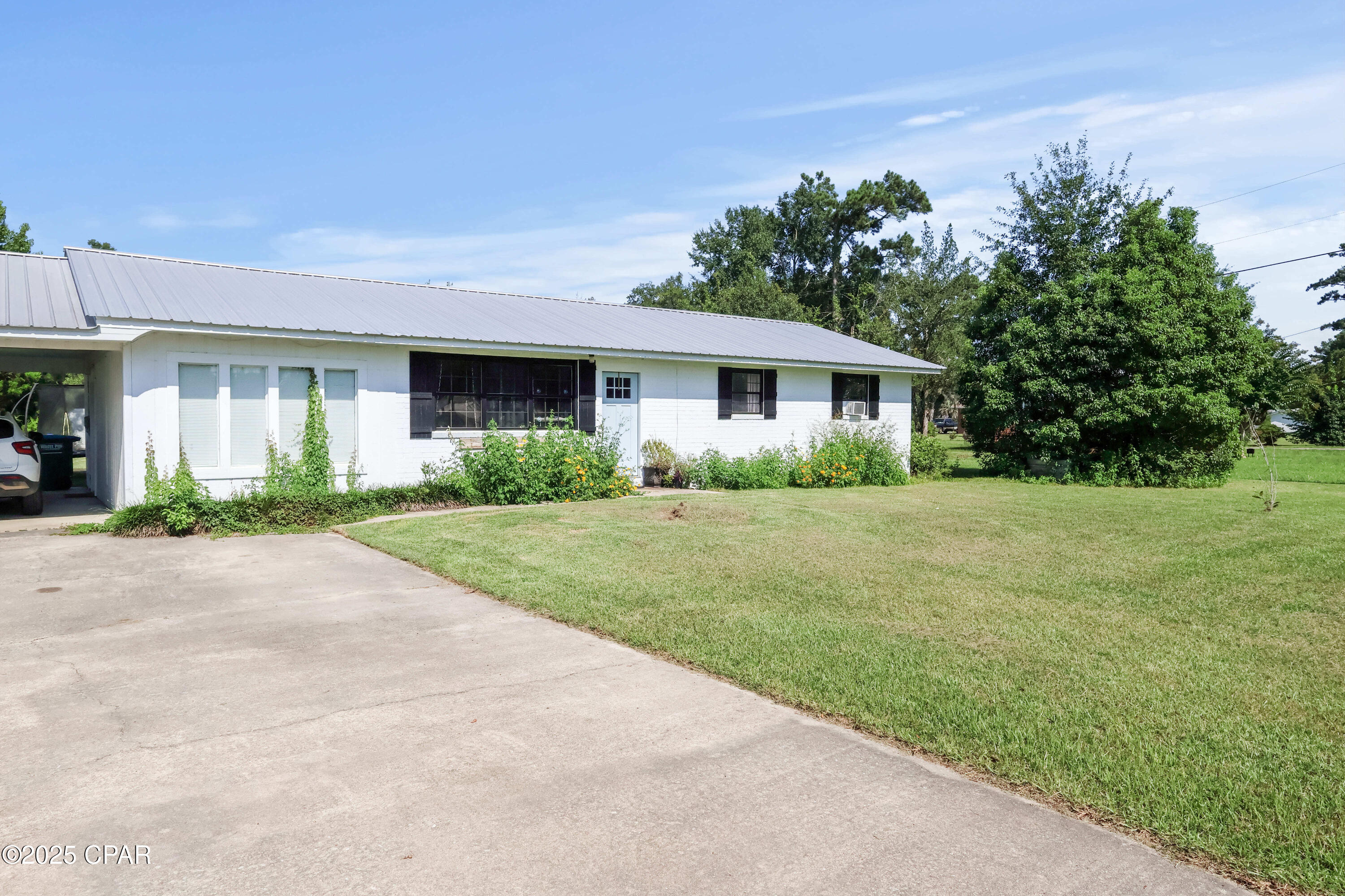 Take a look at 12708 NW Pea Ridge Road -- a 3-bedroom, 1.5-bath home offering 1,400 square feet of living space on a .39-acre lot. This property blends indoor comfort with outdoor freedom, giving you room to spread out and enjoy North Florida living.

Inside, you'll appreciate the open layout filled with natural light. Large windows brighten the main living area, while the seamless flow into the dining and kitchen space makes everyday living and entertaining easy. The kitchen features ample counter space, abundant storage, and a breakfast bar that keeps conversations going while meals are prepared.

Step outside and imagine the possibilities. The backyard provides plenty of room for gardening, play, pets, or weekend cookouts. Whether you're relaxing after work or hosting friends, this outdoor space adds flexibility and enjoyment to daily life. A covered carport offers added convenience, and the mix of brick and wood details gives the home warmth and character.

Located in Bristol, you're just about an hour from Mexico Beach and Tallahassee, 15 minutes to the Apalachicola National Forest, and only minutes from the Bristol Boat Landing. Fishing, boating, hiking, and coastal day trips are all within easy reach.

If you've been waiting for the right combination of space, location, and value -- this is one to see in person. Schedule your showing today and explore what makes 12708 NW Pea Ridge Road such a great place to call home.