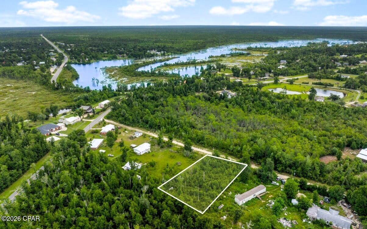 Reasonably priced homesite in sweet area of Deerpoint Lake with nearby access to boat ramps (David Hutchinson or Cedar Creek). No boat? Just run over to Econfina Creek playground of freshwater springs for the kayaker/canoe enthusiast at the rental site or get in at Pitts Springs Park and play area, water on the springs is 68° year-round!  The springs are magnificent and right there.  On this homesite you can build a wonderful starter home, and this area will allow you to place mobile homes on your homesite, so you can begin your home ownership adventure today.  Financing available for qualified buyers.  Give us a call or bring your favorite Realtor now.