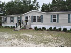 Exceptional manufactured home in the White Western Springs area of Bay County! This Englewood mobile home was built by Cavalier Home Builders in 2004 and includes 4 bedrooms and 2 baths. The home has a split-bedroom floor plan and is perfect for a large or growing family. There is both a living room and a family room; you can use the living room for entertaining guests while the family room is where family members can watch TV, chat, listen to music, play games, etc... The large eat-in kitchen boasts tons of cabinet space, an island sink, Whirlpool appliances and a walk-in lighted pantry. The Master Bedroom includes a retreat area suitable for a nursery or office. The Master Bath includes a double sink vanity, garden tub, separate shower and his-and-hers walk-in closets.