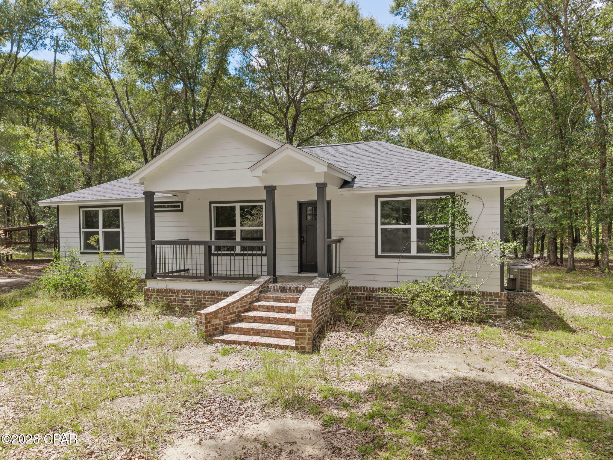 Move-In Ready Meets Country Living! Beautifully remodeled and set on approximately 1.5+/- acres, this 3-bedroom, 2-bath home offers the fresh, updated look buyers love with plenty of room to enjoy the outdoors. Step inside to a bright, open living space featuring attractive flooring, neutral finishes, and a crisp, modern feel throughout. The kitchen is a standout with white cabinetry, granite countertops, stainless steel appliances, black fixtures, and a large island that provides plenty of room for meal prep, entertaining, or gathering with family and friends. The split floor plan offers added separation between the primary suite and additional bedrooms. The primary bedroom features a walk-in closet and private en suite bath, while two additional bedrooms and a second full bath complete the layout. Outside, the open back deck is ready for morning coffee, grilling, or relaxing while overlooking the property. The approximately 1.5+/- acres offer a great mix of open yard and mature trees, giving you room to enjoy the outdoors without feeling closed in. An open pole barn provides valuable, covered space for vehicles, equipment, lawn tools, or recreational toys. With a beautifully remodeled interior, split floor plan, acreage, and useful outdoor space, this home checks plenty of boxes. Come see why this one deserves a spot at the top of your list!