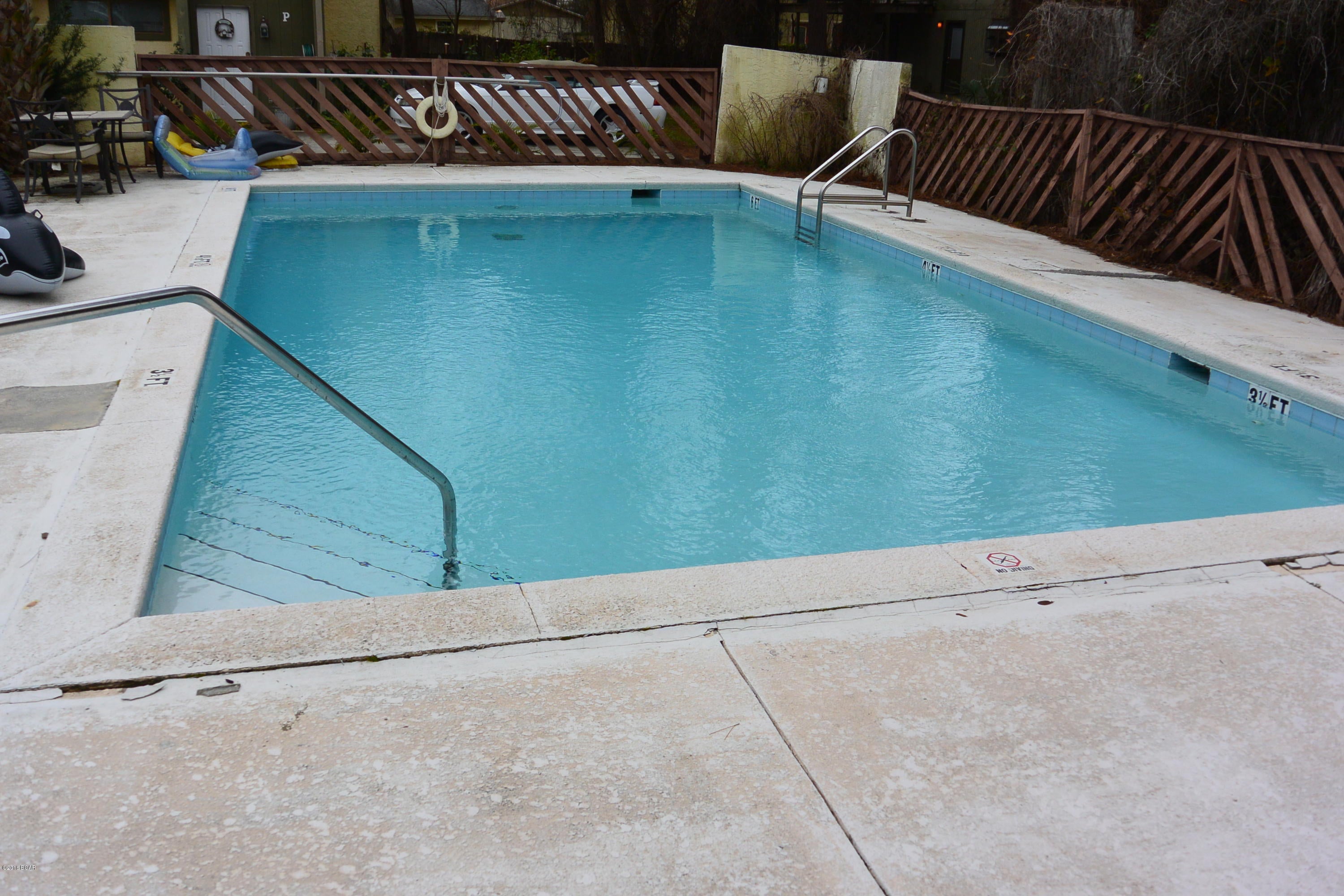 Great price on this 2 bed/2.5 bath condo in the quiet complex of Shade Tree. This complex is conveniently located in the heart of the desirable North Lagoon community and is close to all restaurants and shopping. This   condo features living room, kitchen ½ bath and laundry on the first floor with a patio thru the sliding glass doors in the living room. The second floor has 2 generous sized bedrooms each with their own adjoining  private bath. This unit is ideally suited for a low-cost  home or rental near the Beach. Possible owner financing.