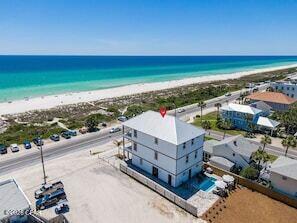 Luxury Gulf-View Property!! West End of Panama City Beach!! VERY HIGH RENTAL PERFORMANCE!! LOCATED DIRECTLY NEXT TO THOMAS DONUTS!!! AND ELEVATOR!!!
Experience coastal living at its finest in this extraordinary custom built 4-bedroom, 4.5-bathroom beach home located on the highly coveted West End of Panama City Beach in the charming Laguna Beach community. Perfectly positioned on an oversized lot with unobstructed Gulf views, less than 100 steps to the beach, this exceptional property offers the ultimate combination of luxury, investment potential, and lifestyle.

Designed for entertaining and relaxation, the home features a private resort-style pool, two spacious upper-level balconies showcasing breathtaking sunsets over the Gulf, and premium indoor and outdoor living spaces throughout.

Inside, you'll find an impressive collection of ultra-premium appliances, designer furnishings, and curated coastal décor, creating a truly turnkey luxury experience. Every detail has been thoughtfully selected to provide both elegance and comfort.

A rare and highly desirable feature is the 2600 square foot, heated and cooled  garage,complete with its own bathroom--ideal for storing boats, recreational vehicles, golf carts, creating a workshop, or additional entertainment space.

With NO HOA, there are no restrictive association fees, allowing for maximum flexibility and excellent investment opportunities. The property boasts outstanding rental performance, making it an ideal primary residence, second home, or income-producing vacation rental. Located just steps from the sugar-white sands of the Gulf and next door to the world-famous Thomas Donut & Snack Shop, this property places you in one of Panama City Beach's most sought-after destinations, close to Pier Park, dining, shopping, and endless coastal activities.

This is more than a beach home--it's a truly rare opportunity to own a premier Gulf-view estate in one of the most desirable locations on the Emerald Coast.