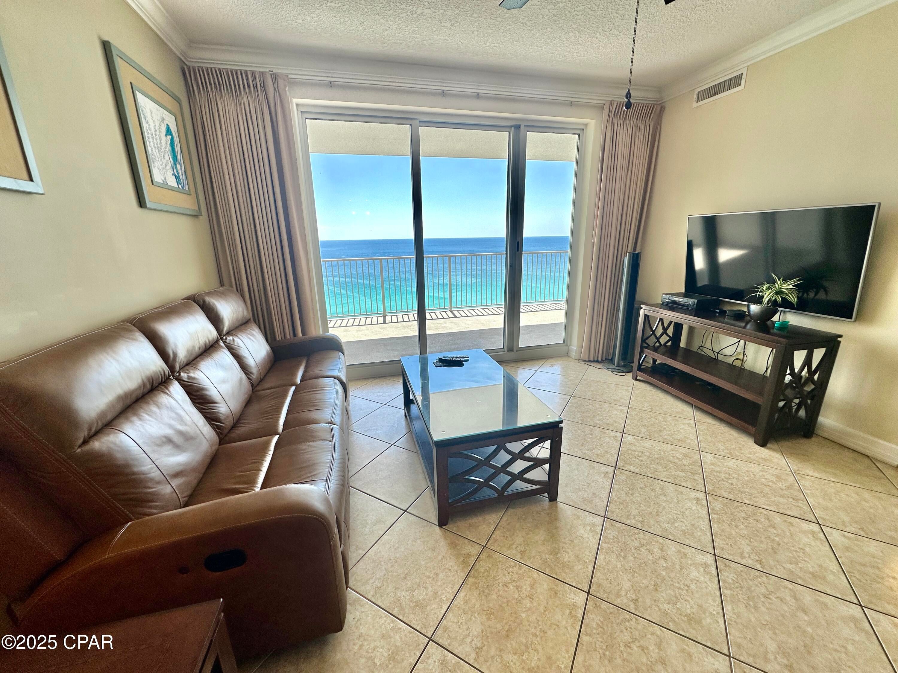 Offered for sale is Ocean Reef Unit 1602, a two-bedroom, two-bath, gulf-front condo with a spacious 10x27 (270+ sq. ft.) balcony.  The Unit 1602 floorplan features: a gulf-front living area and gulf-front master bedroom with separate balcony access; tiled floors; luxury vinyl bedroom flooring; and matching tile backsplash and bar facing. The Ocean Reef balcony size is fabulous and sets it apart from many other resorts. From the moment you walk-in you'll notice the beautiful gulf-views from the kitchen, dining, and living areas.  The master bedroom features a private bath with double vanity. The guest bedroom is large enough for two beds and offers private access to the guest bathroom.  The laundry room includes a side-by-side washer and dryer. Ocean Reef features two pools and a large hot-tub. The gulf-front pool is located directly behind the building. The indoor pool is perfect for colder days. Ocean Reef is perfectly situated!  Just to the west, a short walk away, enjoy delicious meals at the beach-front Runaway Island Restaurant or venture across the street for yummy coffee and donuts at A'more or lunch at the Funland Snack Bar.  Across the street you'll find the Hidden Lagoon mini golf and golf carts or shop at the large Alvin's Island Gift Shop.  The famous Pier Park restaurant, entertainment, and shopping district is just 1.75 miles to the west.  The new TopGolf restaurant, bar, and golfing fun is just 1.5 miles to the west.  Unit 1602 includes your very own exclusive-use, assigned, parking space on level 2 under the building.  No walking across the street or wasted time looking for a parking space.  All dimensions and square footages are approximate and to be verified by buyer if important. The HVAC Unit is dated August 2021. *Living rom sofa does not convey.