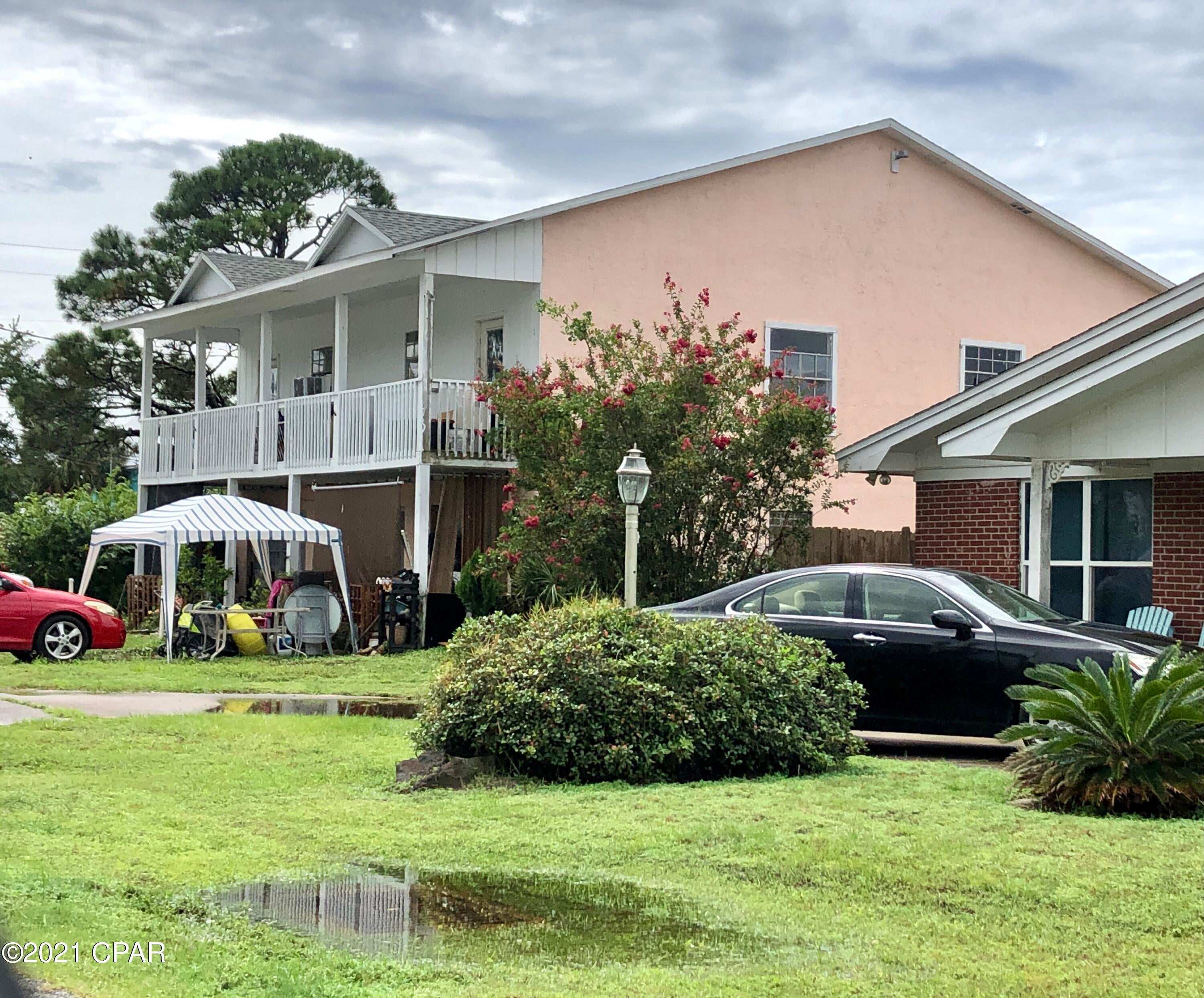 Two-story multifamily building with four units. Two units on each floor with each being two bedrooms and one bathroom for a total of eight bedrooms and four bathrooms.  New roof in 2019. Perfectly located between Grand Lagoon and the Gulf of Mexico. This property is a lucrative investment property.It has tenants in all 4 units. Call for details. Public boat ramps, restaurants, groceries and St. Andrews State Park nearby. A property like this doesn't come along often. So much potential in a stellar location. Walk to the beach for sunrises and sunsets.Contact agent for appointment to show.