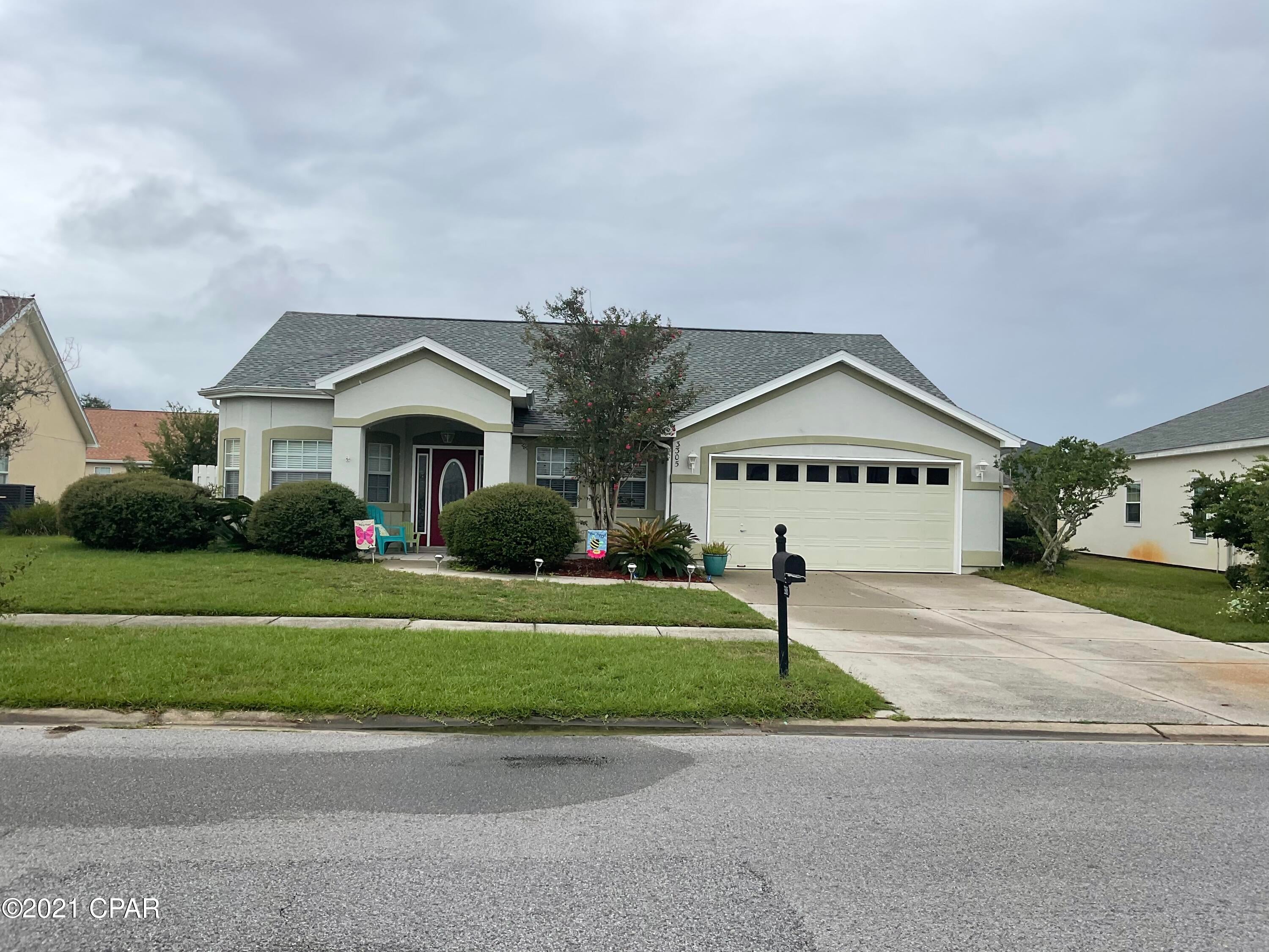 Welcome to the Hammocks one of the most sought after subdivisions in Bay County!  This home is centrally located in Lynn Haven convenient to schools, shopping, and entertainment. Walking distance to Mosley High School and Bay Haven Charter Academy. A community with sidewalks, a gorgeous community pool, and streetlights. The spacious living room has an electric fireplace and sliding glass doors that open to a covered patio and privacy fenced yard. Formal dining and breakfast nook. Tankless gas water heater. Master bedroom en-suite with double vanity, garden tub, water closet, and his and hers walk-in closets. master bedroom has private access to the back covered patio.  All measurements are approximate. Please verify if important.