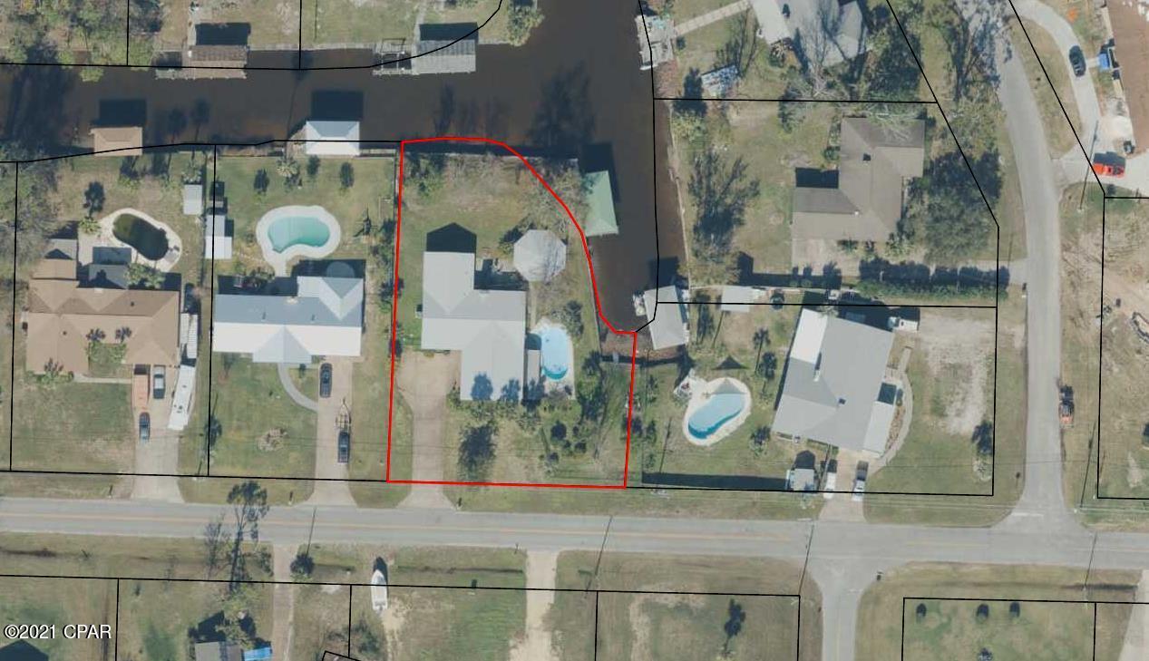 **CURRENTLY UNDER CONTRACT, ACCEPTING BACK UP OFFERS** Wonderful Lynn Haven waterfront home with inground pool, boat lift/dock and guest house. Large lot with canal on two sides and deep water access to North Bay and a short boat ride to the Gulf. The property has gorgeous hardwoods and an abundant variety of fruit trees!! Main home is a 3/2 with open floor plan, large pantry, oversized garage with extra storage and many updates including stainless appliances, super efficient HVAC, and granite countertops. Guest house floor plan boasts windows with waterviews, one bedroom, full bath and a walk-in closet. Conveniently located to shopping, schools, dining and the World's Most Beautiful Beaches.