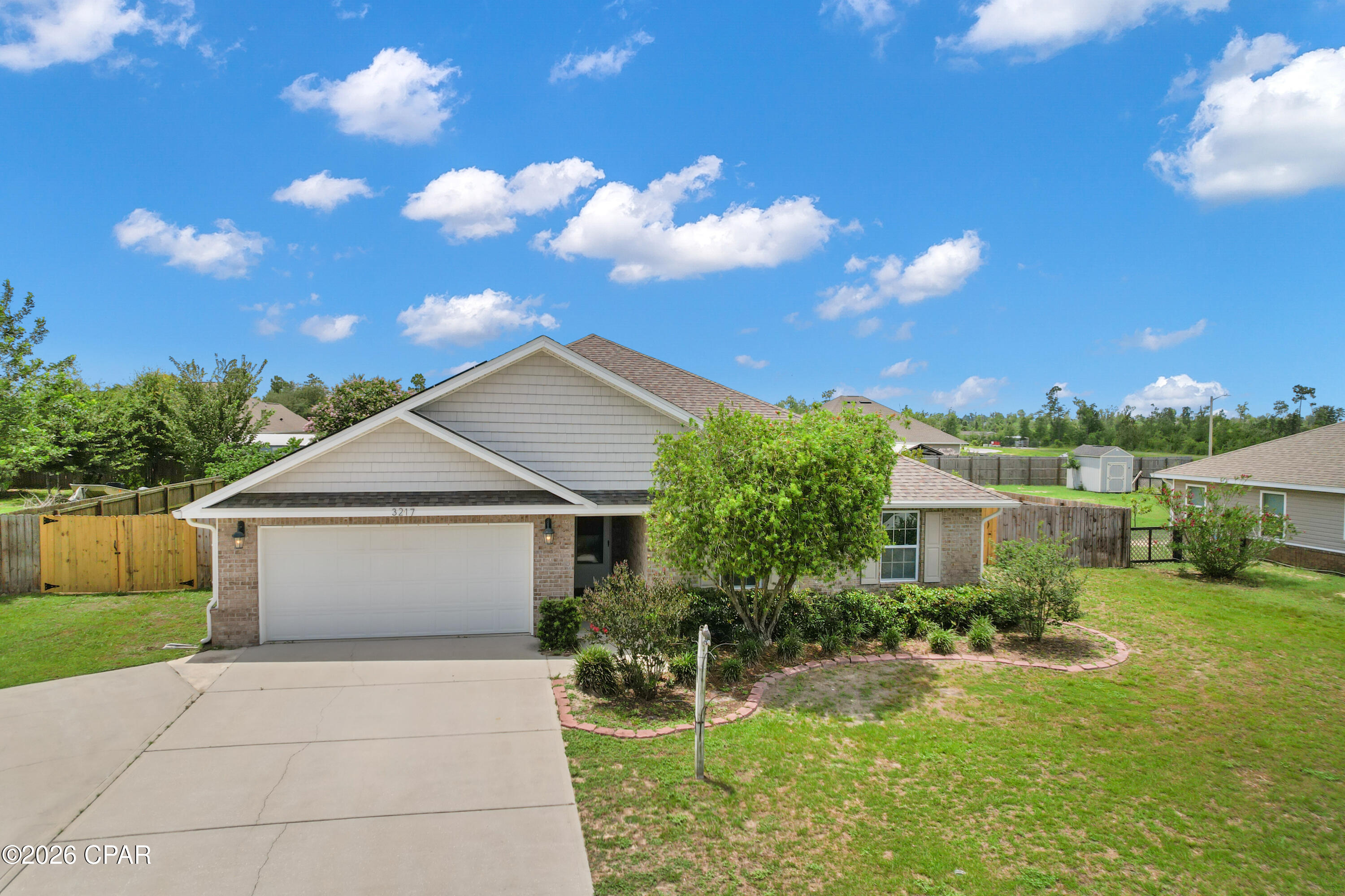 Prime location and move-in ready! This 4-bedroom, 2-bath home is located in Phase III of Magnolia Hills and offers a functional split-bedroom floor plan with plenty of space. The kitchen and living room are bright and airy and overlook the pool. The primary suite features a double vanity, separate tub and shower, and a large walk-in closet.

Step outside and enjoy the backyard, complete with a privacy fence, screened-in pool enclosure (2021), and plenty of room to relax or entertain. Additional features include a 22kW Generac whole-home generator and paid-off double solar panels for big energy savings.

Conveniently located near schools, shopping, dining, Tyndall Air Force Base, and all that Panama City has to offer. Buyer to verify any information deemed important.