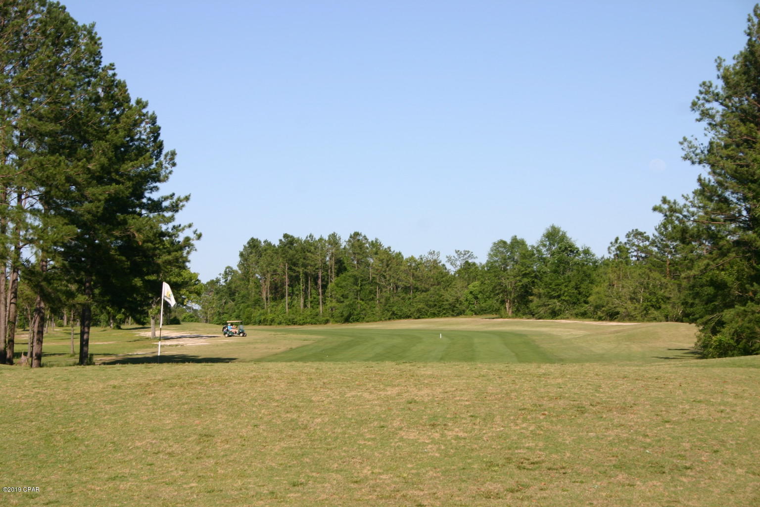 Here's your chance to own a golf front lot in Sunny Hills. Lot has a view of one of the challenging holes. This 18 hole public golf course is very popular in this area. Very affordable greens fees. Sunny Hills is located approximately 25 miles north of Panama City and 18 miles south of Chipley. The community not only features the golf course but also many fine fishing and recreation lakes. You owe it to yourself to check out this area. Great place to build your golf front home or just invest in the future of the Florida Panhandle.