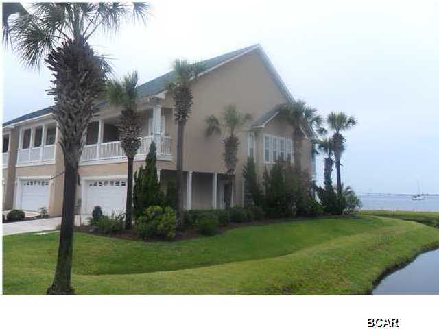 FANTASTIC BAY FRONT TOWNHOUSE RARELY AVAILABLE * OPEN FLOOR PLAN * THE BAY CAN BE SEEN FROM THE KITCHEN DINING AND LIVING AREA * THE SCREENED PORCH IS WONDERFUL FOR WATCHING THE DOLPHINS AND BOATS * THERE IS A POWER ROOM ON THIS FIRST LEVEL * THE MASTER SUITE IS ON THE SECOND FLOOR AND IS FIT FOR A KING & QUEEN * THE BEDROOM HAS FRENCH DOORS TO A BALCONY OVERLOOKING THE BAY * HUGE MASTER BATH WITH JACUZZI TUB, SEPARATE SHOWER & TWO VANITIES * THE CLOSETS AND STORAGE ARE WONDERFUL * THE OTHER TWO BEDROOMS ARE LARGE WITH SEPARATE BATHROOMS * THIS UNIT IS IN EXCELLENT CONDITION WITH CARPET & TILE THAT LOOK NEW * PELICAN BAY OFFERS TWO PIERS, CLUBHOUSE, EXERCISE AREA, POOL, HOT TUB, AND WALKING TRAILS. WHAT A BEAUTIFUL HOME OR VACATION PLACE * BEAUTY & SOLITUDE!