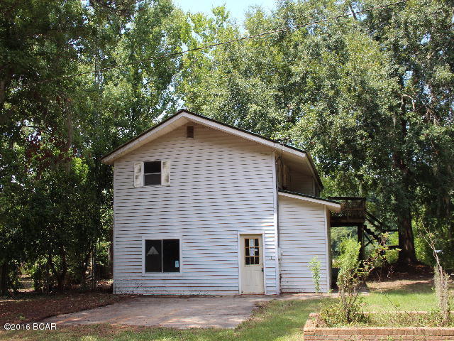 PRICE REDUCED!!! House on the river! This two story home overlooks the Appalachicola River for great fishing. There is a large living room downstairs with massive stone fireplace and a large utility/workroom. Upstairs is the kitchen, dining room, two bedrooms and a bathroom. The master bedroom has nice view of the river. It is located next door to a nice public boat ramp. Bring your boat and let's go fishing!