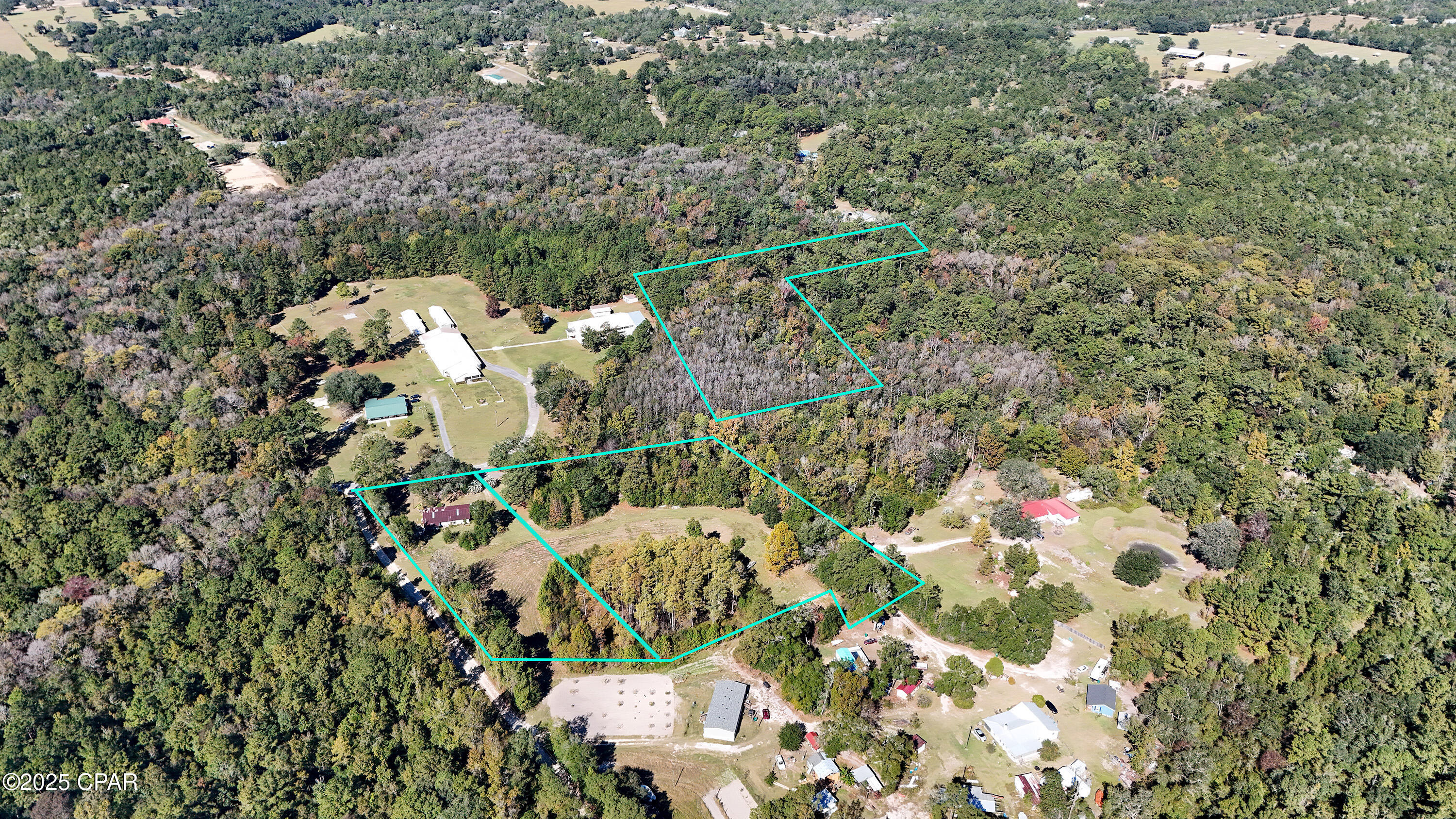 Unlock the potential of nearly 10 acres in a strategic Chipley location just off Hwy 77 N, offering versatility for future development, renovation, or long-term investment.
This multi-parcel property delivers a rare combination of acreage, flexibility, and layout options—ideal for those seeking land with multiple avenues for future use. With open areas, wooded sections, and a 2,264 sq ft distressed home ready for redevelopment, the possibilities are wide-ranging.
The first parcel (00000000-00-3334-0003) will be sold without the southwest portion (approx. 2.25 acres), leaving approximately 8.63 acres across two separate lots. The size and layout provide an excellent foundation for new construction, agricultural plans, recreational use, or phased development projects.
The second parcel (00000000-00-3335-0003) will be sold without its southwest section (approx. 3.30 acres), leaving an approx. 1.25-acre lot across the street. This parcel connects to the lot with the distressed home, creating opportunities for a primary residence, investment property, or additional build site to complement the surrounding acreage.
One of the included lots is wooded and features a small finger of Pine Log Lake extending onto the property, adding scenic character and enhancing the land's appeal for outdoor-minded buyers or those envisioning a natural buffer around future improvements.
With multiple parcels, varying landscapes, and buildable configurations, this property supports a wide array of potential uses—from a private residential setup to multi-site planning or a long-term hold in an expanding market. The proximity to Hwy 77 N further increases accessibility for future projects. Call a REATLOR today to schedule a private property tour. 

Buyer to verify all measurements, parcel boundaries, and usage opportunities.