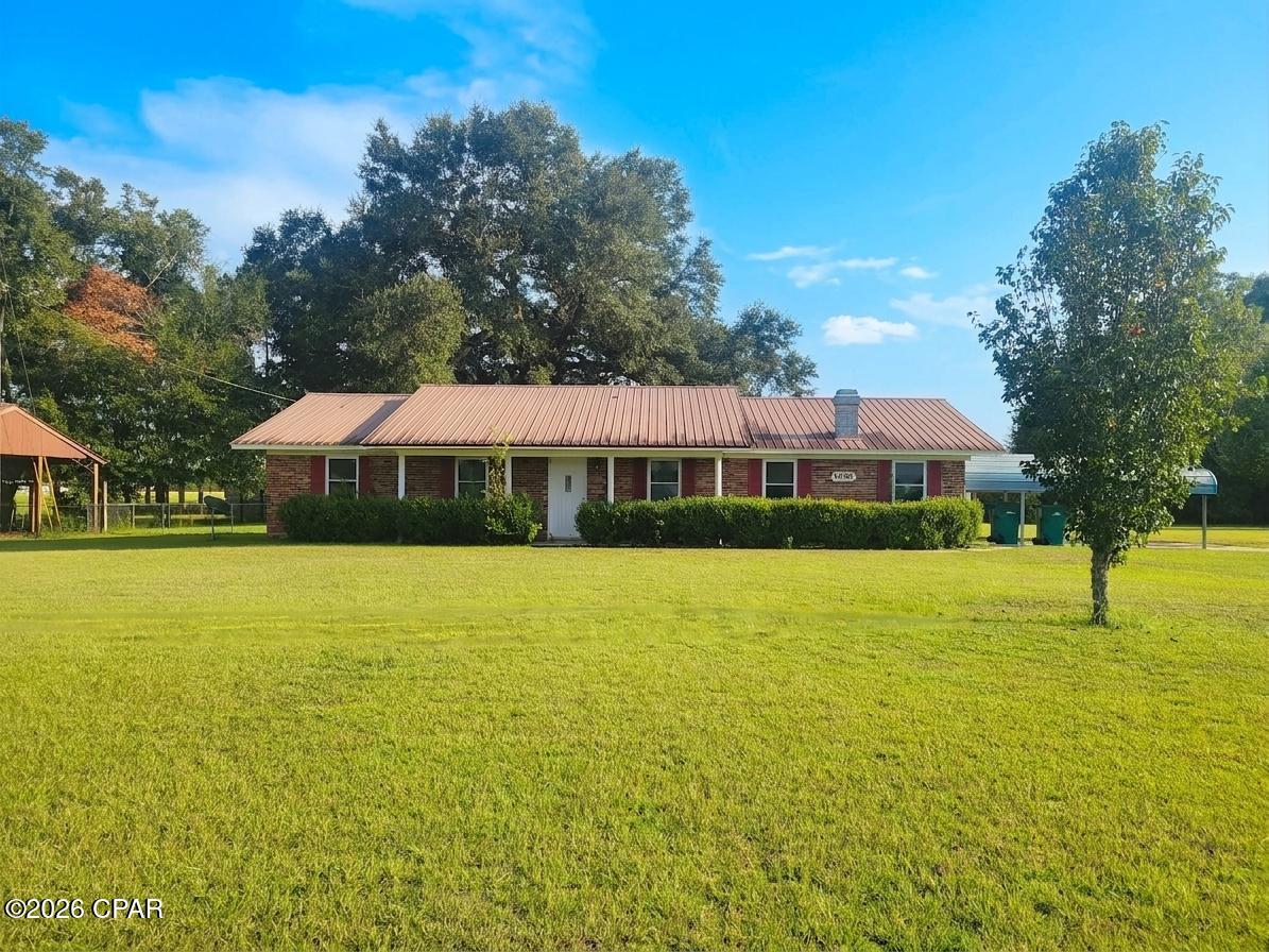 Welcome to this charming 3-bedroom, 2-bath brick home situated on a full acre in a peaceful country setting. Located on a paved road, this property offers plenty of space both inside and out.

The home features a large living room with a wood-burning fireplace and an updated kitchen with granite countertops, LVP flooring, and updated Whirlpool appliances. A versatile bonus room offers even more possibilities and could easily be converted into a 4th bedroom, home office, playroom, or additional living space. Other notable features include new windows throughout, updated bathroom cabinetry with granite countertops, a metal roof, washing machine, dryer and a whole-home water softener.

Step outside to a large, fenced backyard with plenty of room for pets, children, gardening, or entertaining. The back porch features low-maintenance Trex decking, providing a great space to relax and enjoy the country setting.

For those needing extra storage or workspace, this property delivers! A 20' x 20' workshop with power and a roll-up door provides ample room for projects, equipment, or storage. Just behind it is an additional 10' x 20' insulated workshop with power, offering even more usable space.

The home could use a little TLC and some finishing touches, making it a great opportunity for a buyer to add their own style and make it their own. With a solid brick exterior, one acre of land, multiple powered workshops, a fenced backyard, and several desirable updates already in place, this property offers plenty of potential for someone looking for country living with room to grow.
