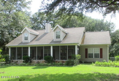 Beautiful Country Home surrounded by large Oaks and beautiful country setting. This 3/2 home, built in 2007 is energy efficient and built with top quality flooring, cabinets and counter tops. Large Workshop/Man-Cave with extra carport area for vehicles or equipment. Animals are allowed and there is plenty of room for pasture. Enjoy the screened in front porch and the beautiful yard at the end of Libby Lane!