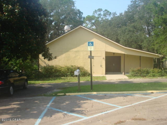 This is an open blank slate ready for your floor plan design.  This 2900+ square foot facility was used as a meeting place, could be converted to a residential home.  The site is comprised of two lots with approx. 200 feet on Martin Lake. The building has a commercial kitchen, and commercial restrooms built to ADA code. Major upgrades were done in 2002. The property has a paved parking lot, lower level recreation room, storage rooms, office space. The roof was replaced after hurricane Michael and some site work and interior sheetrock and miscellanous maintenance and repairs required.