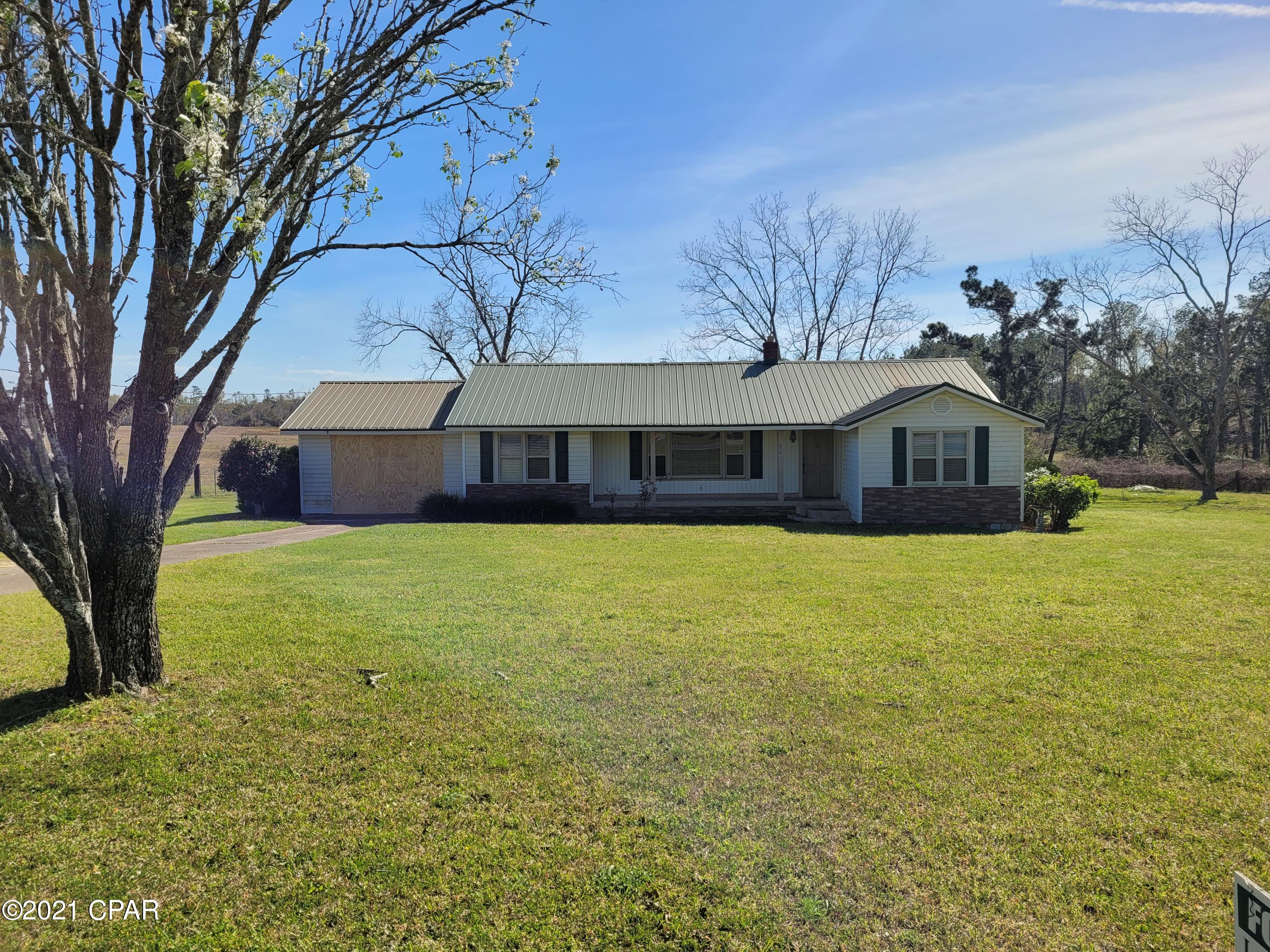 Large Family home in Marianna with 1872 sq ft under air located on 1 acre!! Original hardwood floors in bedrooms, tile flooring in kitchen and family room. Large kitchen with lots of cabinets. Metal roof, deck on back, and a large barn for extra storage for all your toys. Large backyard with plenty of room for the kids to play! This home will not last long on the market at this price so call today for your personal showing.