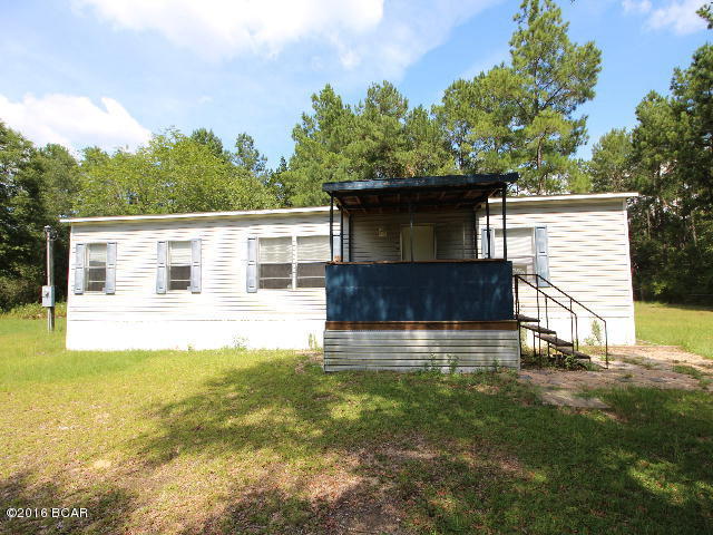* PRICE REDUCED * This is a nice double wide mobile home situated on an acre lot in the country. It has nice design with large living room, 3 bedrooms and 2 baths and a covered front porch. One of the bathrooms needs a tub installed. The lot is large enough for you to have a garden spot and room for children to play.