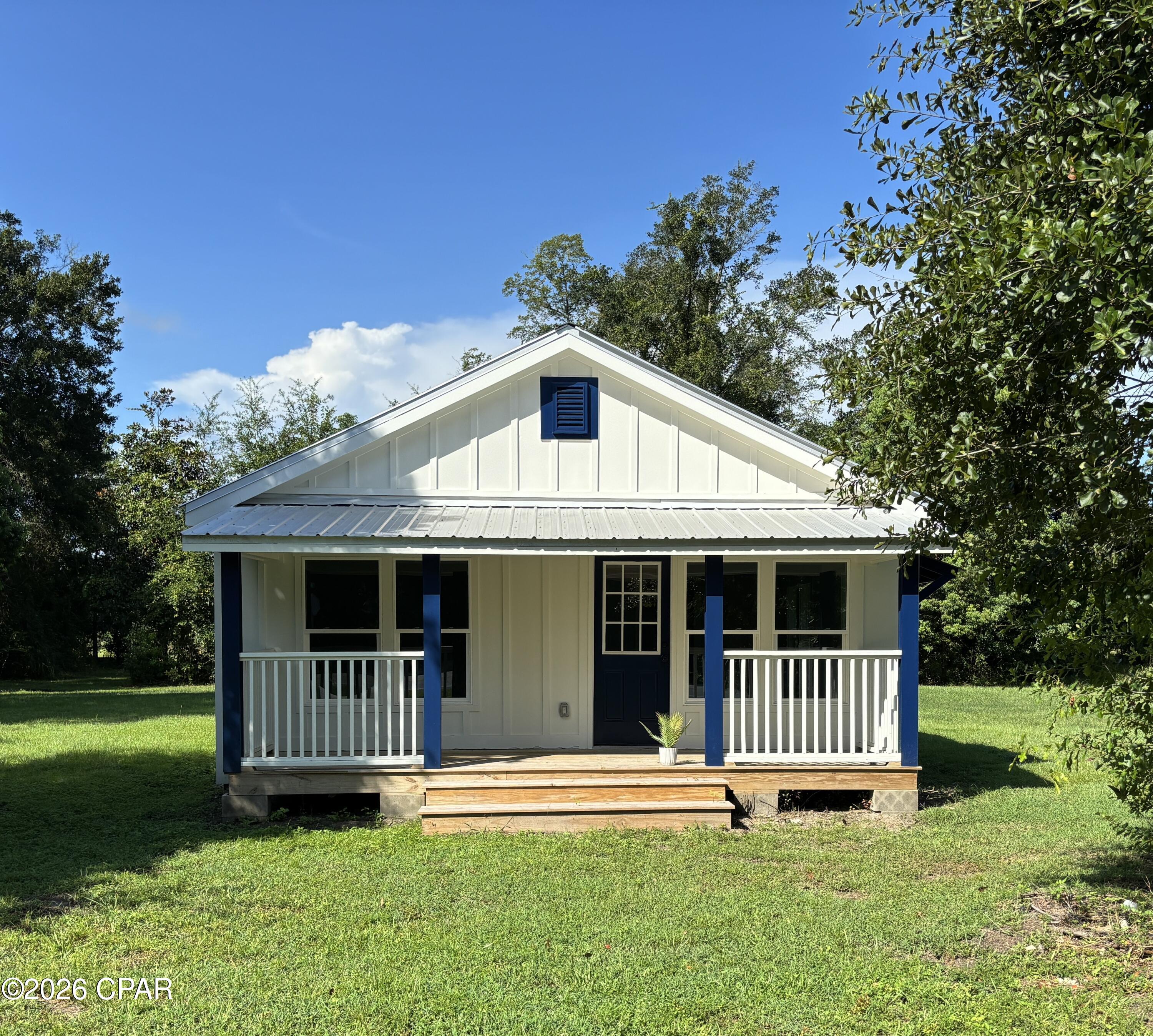 Newly renovated cottage on a large .84 acre lot with plenty of room for all of your toys. This 3 bedroom 2 bath cottage is located about 2 minutes south of Wewahitchka, Florida and is very close to the world famous Dead Lakes and Apalachicola/ Chipola River systems. Easy access to Port St Joe, Florida and Mexico Beach, Florida in less than 30 minutes. Turn key ready with an open floor plan cozy covered front porch, new appliances, appliances, fixtures and bathrooms. Easy accessibility as this cottage is located in the coveted X flood zone which can mean thousands in savings on flood insurance. Oversized lot with many possibilities such as a garden or landscaping, etc. Two pole barn type structures that will serve as great outbuildings or potential workshops. Turn key ready and neat as a pin. Some measurements were taken from the Gulf County Property Appraiser's website, Please verify if important.