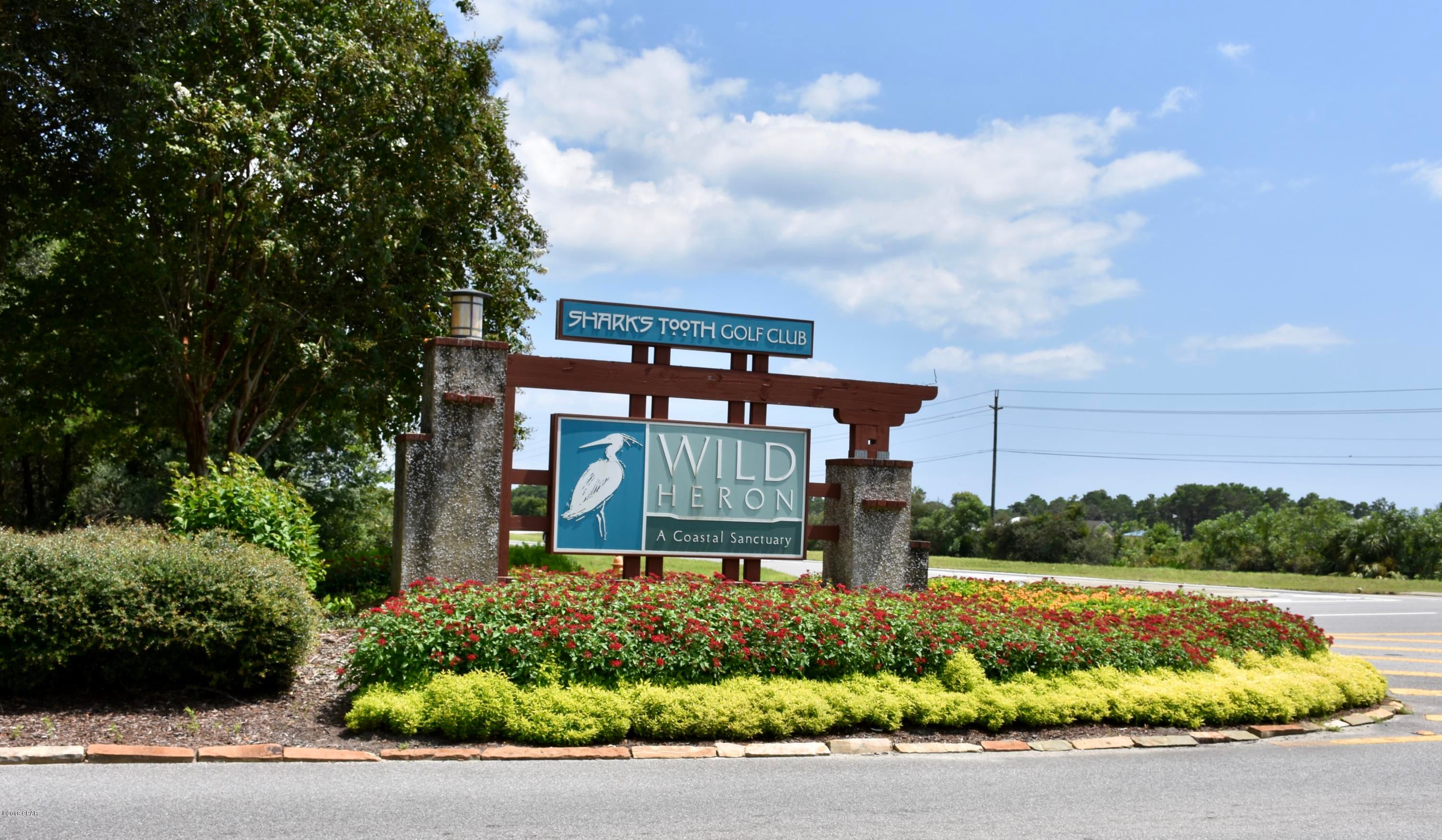 Just driving into the gates of Wild Heron give you a sense of security, peace, and natural prestige! This community offers beautiful views of a golfer's dream course, Shark's Tooth by Greg Norman, and you have membership potential as an owner. In addition, there are Audubon awarding areas to enjoy nature untouched and birds within their natural habitats! Use your kayaks, paddle boards and/or small boats (if owned) for enjoying Lake Powell--you can ride them all the way to the beach!! There fire pit and boathouse with incredible views for entertaining, and a pool/hot tub/library/gym/locker room area complete with food bar for catering to yourself daily! Don't miss this chance to own a slice of natural perfection for under $40k! Call me today!