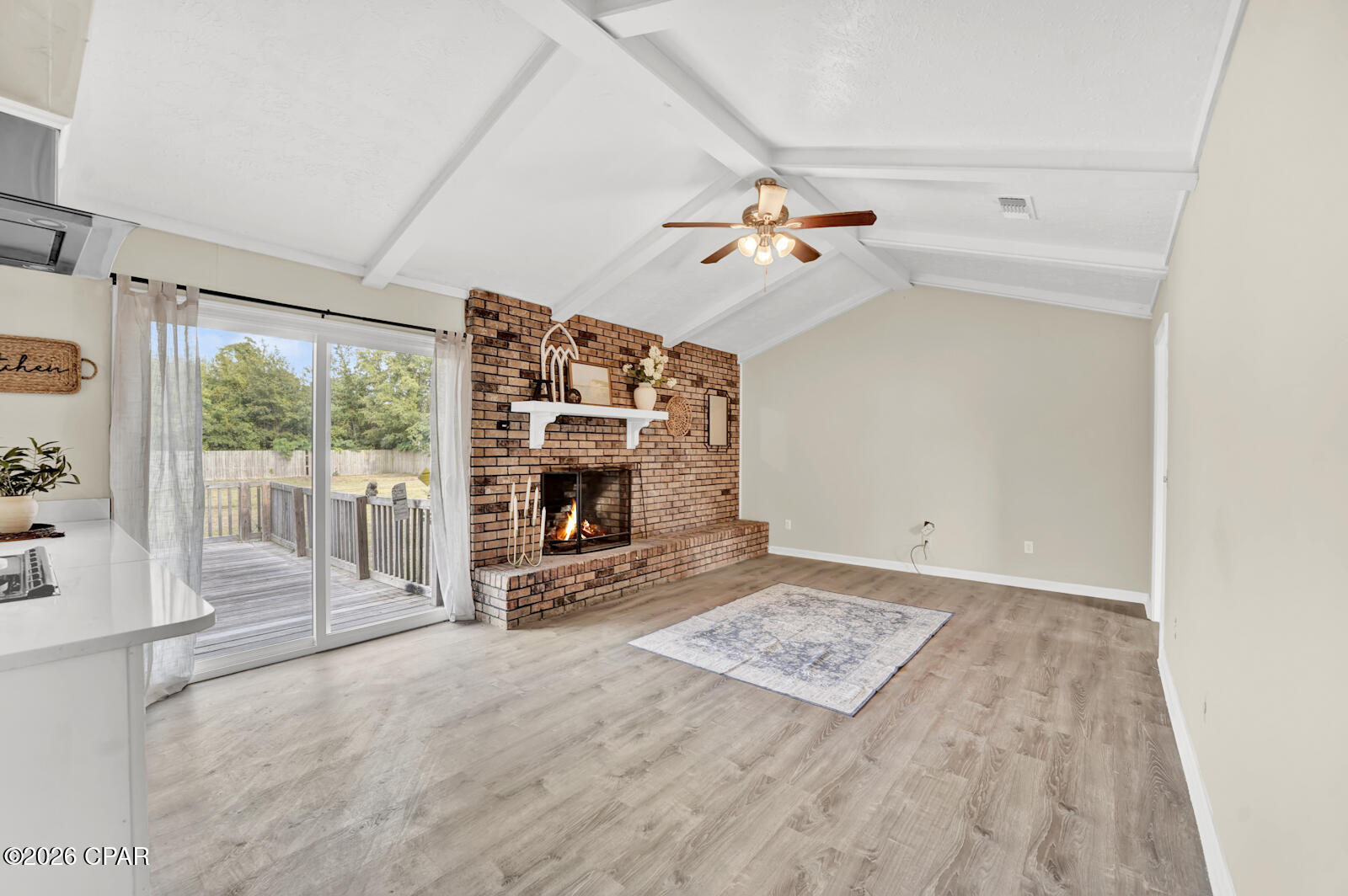 This one checks all the boxes--updated, move-in ready, and sitting on a rare .55-acre lot in Lynn Haven.

Recently redone, this home offers that ''like-new'' feel without the wait. The bathrooms were renovated in 2026 featuring new vanity's, toilets,  bath / shower combo + a walk in shower in the primary, paired with an updated kitchen and clean, cohesive finishes throughout.

With two living areas, a formal dining room, and an eat-in kitchen, the layout was designed with both everyday living and hosting in mind. The wood-burning fireplace creates a cozy focal point, while the overall flow gives you flexibility to use the space however you need.

Step outside and you'll see where this property really stands out--the lot size. Whether you're dreaming of a pool, shop, or simply more space to spread out, you have the room to make it happen.

Located in the North Shore area of Lynn Haven, just minutes from SweetBay Publix, shopping, and dining--this is one you don't want to miss.