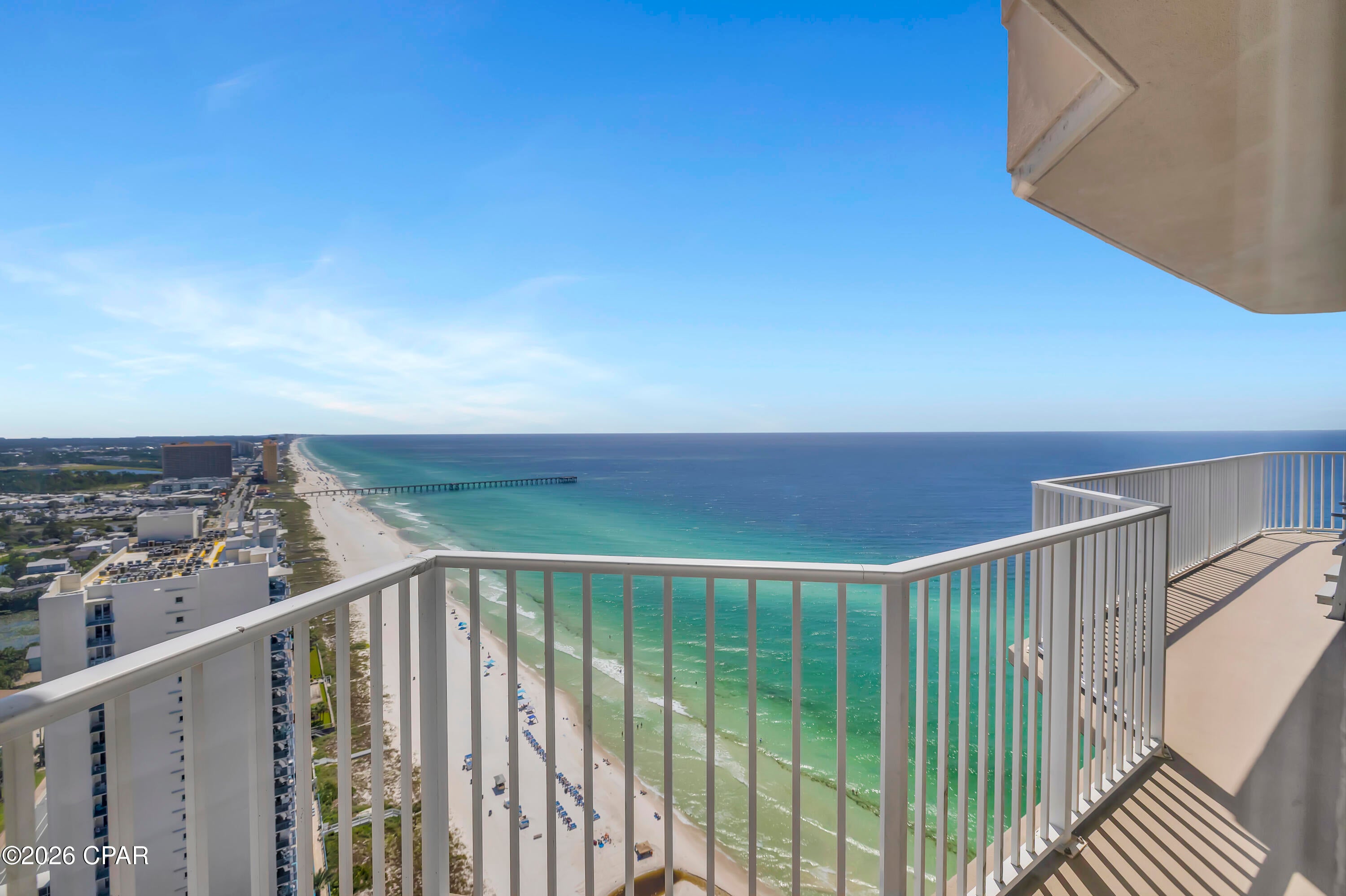 TOP OF THE EMERALD COAST. SUNRISE TO SUNSET. UNOBSTRUCTED COASTLINE VIEWS. Tidewater Penthouse 3017 occupies the 30th and highest residential floor of Tidewater Beach Resort, delivering the highest residential vantage point available anywhere in Northwest Florida. From this top-floor corner position, the wraparound balcony and floor-to-ceiling windows open to turquoise Gulf waters, an expansive horizon, and coastline views stretching in both directions. Watch the sunrise over the eastern coastline, the sunset over the Gulf, and Fourth of July fireworks over the Pier and SkyWheel at Pier Park, all from one extraordinary residence. When the goal is to be above it all, there is nowhere else to go.
This 3-bedroom condo with a bonus bunk area and 3 full bathrooms has been fully renovated to the studs and finished to an exceptional standard. The residence includes two en-suite bedrooms, an additional bedroom, and a dedicated bunk area, with sleeping accommodations for up to 10.
Inside, the attention to detail is immediately apparent. Fresh paint, updated interior doors, remodeled bathrooms with upgraded tile, upgraded flooring, shutters, granite countertops, updated cabinetry, stainless steel appliances, and thoughtfully selected coastal furnishings create a cohesive interior that complements the remarkable setting.
Even the shiplap reflects the level of care that went into the renovation. In key areas, oversized boards were used to eliminate visible cuts and seams. Because the material would not fit inside the elevator, it had to be carried approximately 30 floors rather than compromise the finished appearance. It is a small detail that speaks volumes about how deliberately this residence was completed.
The living area is framed by expansive windows and opens directly to the wraparound balcony, with roll-up shades providing flexibility throughout the day. The corner orientation creates a rare combination of Gulf, horizon, coastline, sunrise, and sunset views from the highest residential level in Panama City Beach.
Penthouse 3017 is not currently being used as a rental, allowing for flexible showing availability without an active rental calendar. The HVAC system was replaced in 2020, and the water heater was installed in 2021. Two designated covered parking spaces are included, with covered access across Front Beach Road via the skywalk. New high-speed elevators are located directly adjacent to the residence. The current owner also rents a storage unit on the 30th floor, with the opportunity for the new owner to continue that arrangement subject to availability and applicable terms.
Tidewater Beach Resort offers an extensive Gulf-front amenity package including two outdoor pools, a heated indoor pool, four hot tubs, a Gulf-front fitness center, Roman spas and saunas, a movie theater, on-site dining, tiki bar, game room, beach store, and a 30th-floor owner's lounge with panoramic views. Owners also receive a professional beach setup with two chairs and an umbrella, subject to resort policies and seasonal availability.
Located near Pier Park, restaurants, shopping, entertainment, and Northwest Florida Beaches International Airport, Tidewater Penthouse 3017 brings together a top-floor corner position, unobstructed views, a complete renovation, and a level of craftsmanship rarely found at this height.
HOA dues are $4,310/quarter and includes: Building Insurance; Internet-WiFi; Maintenance Grounds; Pest Control; Pool; Sauna/Steam Room; Spa/ Hot Tub; Trash Disposal; Water & Sewer. 
All information is deemed reliable but not guaranteed; buyer to verify if important.
