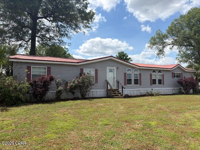 Discover the possibilities with this 10.33-acre property offering space, flexibility, and a prime location along a major four-lane highway with convenient access north toward Montgomery and south to the Gulf Coast beaches.  The property features a well-maintained 4-bedroom, 2-bath doublewide mobile home with 2x6 exterior walls and a desirable split-bedroom floor plan. Inside, you'll find a spacious kitchen and dining area with abundant cabinet and counter space, plus a cozy wood-burning fireplace in the living area. The large primary suite includes a walk-in closet, jetted tub, separate shower, and double vanity. Two additional bedrooms also offer generous walk-in closets.  Outdoors, enjoy established fruit trees--including peach, pear, chestnut, mulberry, and apricot--supported by dedicated water lines. Additional improvements include a storage building and a metal carport that can also serve as a covered outdoor entertaining space.  A 2006 3-bedroom, 2-bath singlewide mobile home is also on the property and may remain with acceptable terms or be removed prior to closing.  For those seeking even more space, an adjoining 10-acre parcel with a brick home and large barn with stalls is available for purchase (see MLS 789294). This property presents an excellent opportunity for a family compound, hobby farm, or investment.