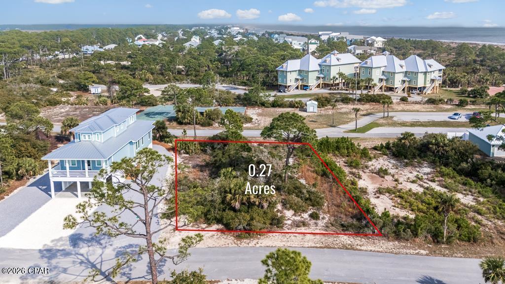 SOUTH CAPE HOMESITE with GULF AND BAY ACCESS! Boasting a generous 100 x 120 lot size, this spacious homesite offers plenty of room to design the perfect beach retreat while still enjoying privacy and security within the community, all with a minimal HOA fee. Offering both beach and bay access, this homesite provides the perfect opportunity for endless outdoor adventure. Embrace the natural beauty of Cape San Blas, renowned for its unspoiled shoreline, breathtaking sunsets, and laid-back coastal charm. Spend your days exploring sugar-white beaches, taking peaceful walks along the water, swimming in the Gulf, or simply soaking in the serene surroundings. Just outside the gates, you'll find a bike path leading directly to Salinas Park, where you can enjoy pickleball, playgrounds, and additional recreational amenities. For water enthusiasts, this area is a true paradise, offering exceptional fishing, boating, kayaking, and paddleboarding. Abundant marine life and scenic bay waters await exploration. Whether you're planning a primary residence, vacation getaway, or investment property, this homesite offers the ideal setting to experience the very best of coastal living.
