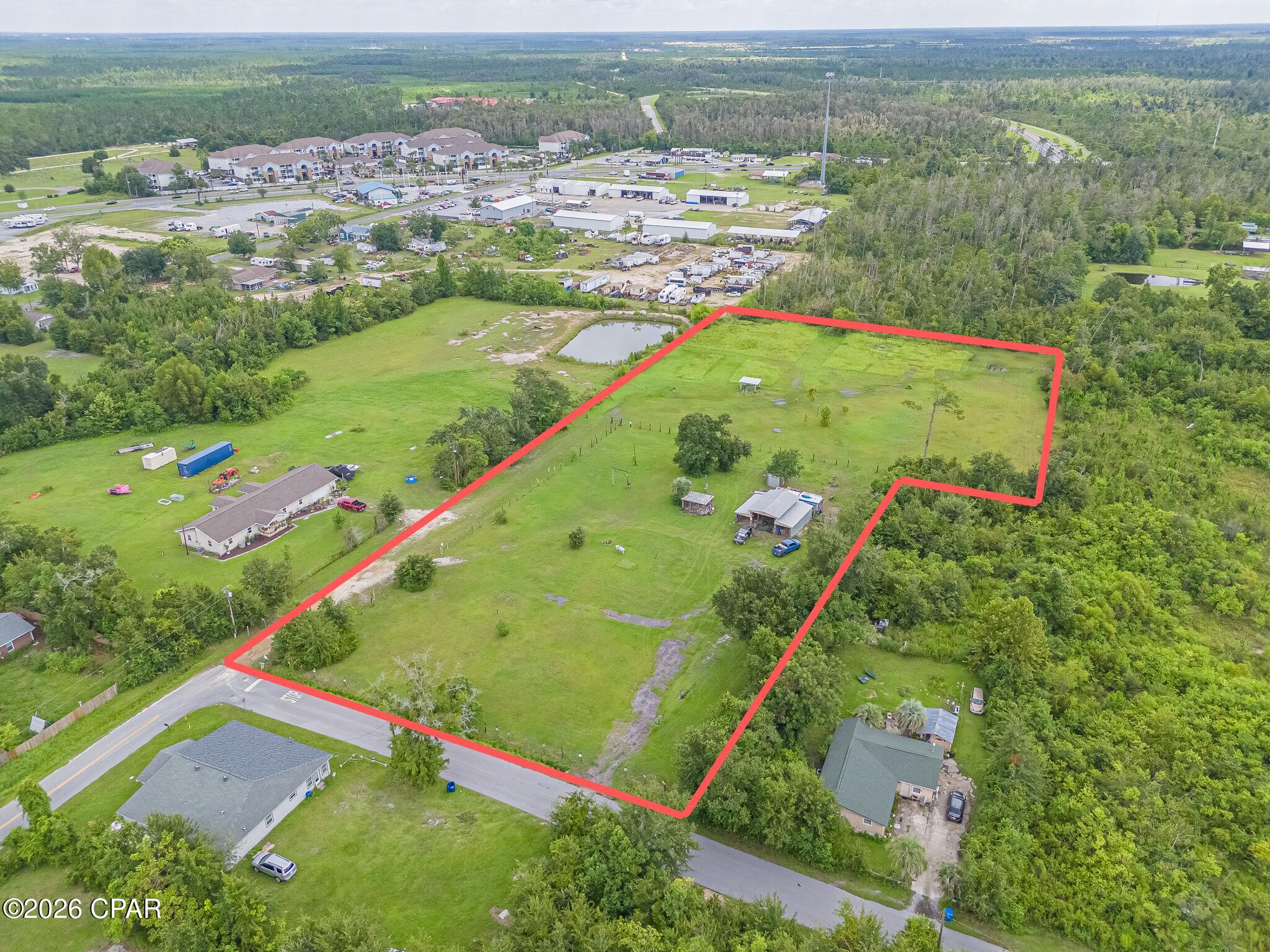 Discover the possibilities with this  4.27 -acre property offering plenty of space and potential in a convenient location. Featuring mostly level terrain, this property is situated near unincorporated Springfield while providing easy access to shopping, restaurants, and other everyday conveniences.
Downtown Panama City and historic Downtown St. Andrews are both approximately an 11-minute drive away, giving you the opportunity to enjoy nearby dining, entertainment, waterfront activities, and local attractions while still having plenty of room to spread out.
The property offers electricity and water already available, adding value and convenience for future development. A large pole barn with a camper hookup is also currently in place, providing additional versatility for storage, recreational use, or other needs.
The property provides an excellent opportunity for a custom-built home or qualifying modular home, subject to applicable zoning, permitting, and restrictions.
With  4.27 acres, existing utilities, a pole barn, and a convenient location, this property offers an excellent opportunity for buyers looking for space and future possibilities.