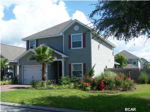 HERE IT IS! A long-term rental house on the west end of Panama City Beach! Perfect location; quick access to the beautiful beaches of Bay County, 30A, and South Walton County. This Turtle Cove home has two master bedrooms; one on the first floor and one on the second. Large room at the top of the stairs can be utilized as the 5th bedroom or recreation room with storage closet. Privacy-fenced back yard and enclosed back porch make this ideal for evenings outside. Home features engineered hardwood floors in the foyer, dining and living room, ceramic tiled floors in the kitchen, baths and laundry, and carpet in all the bedrooms. Tenants have access to large community pool, spa tub, and the large clubhouse which is directly on Lake Powell.
